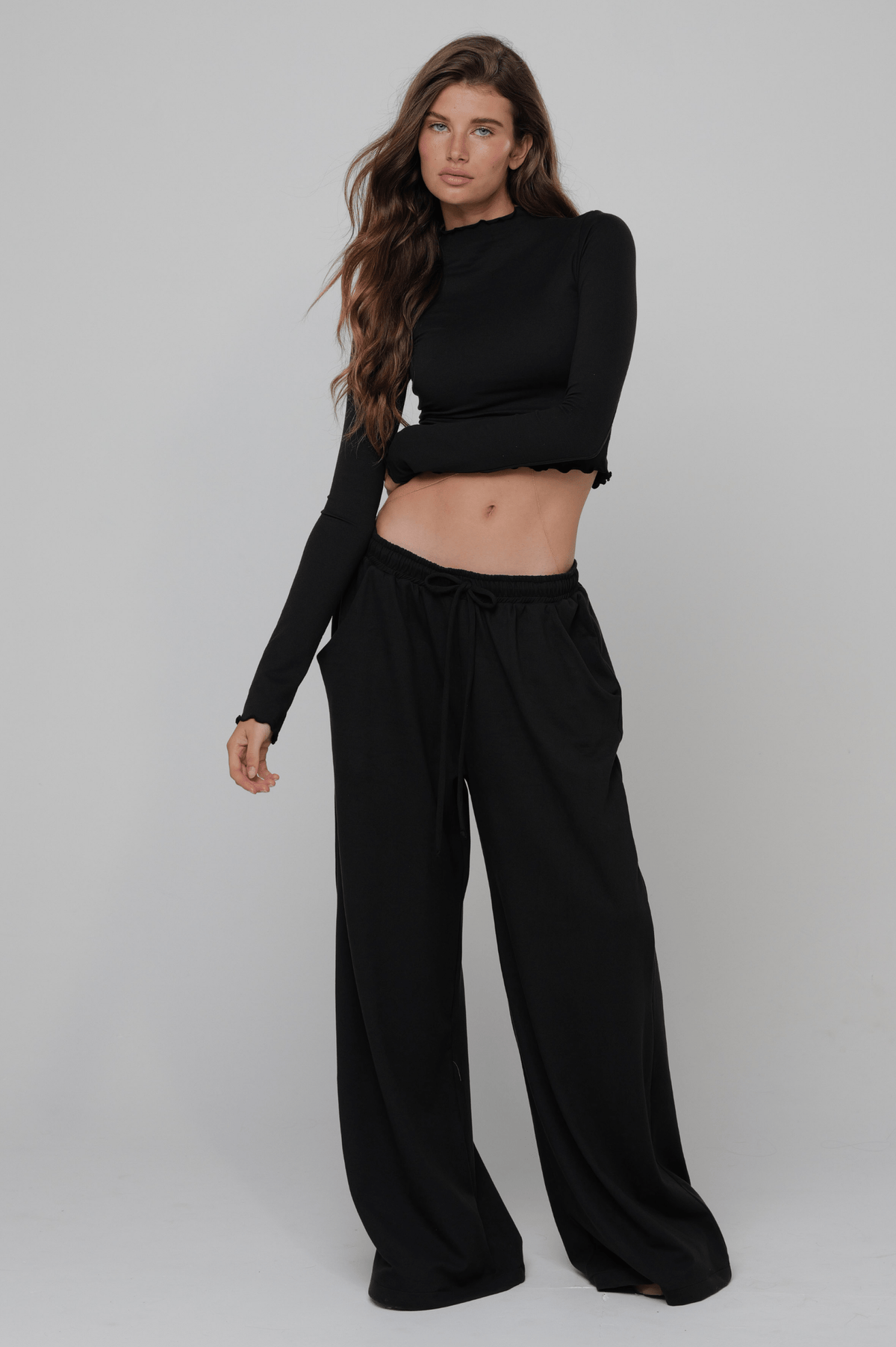 This is an image of Ida Top Second Skin in Black - RESA featuring a model wearing the dress