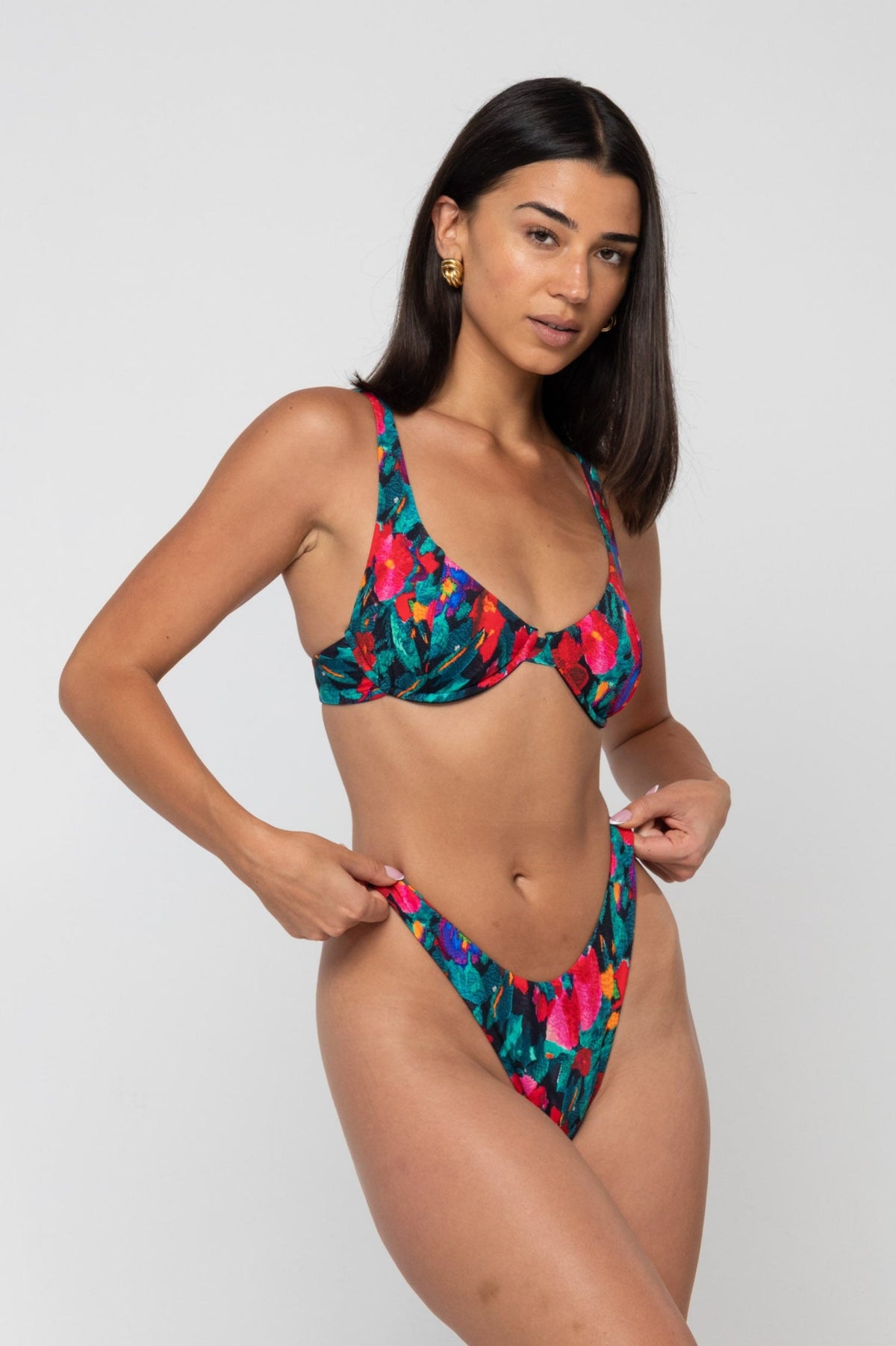 This is an image of Joey Bikini Bottom in Resort - RESA featuring a model wearing the dress