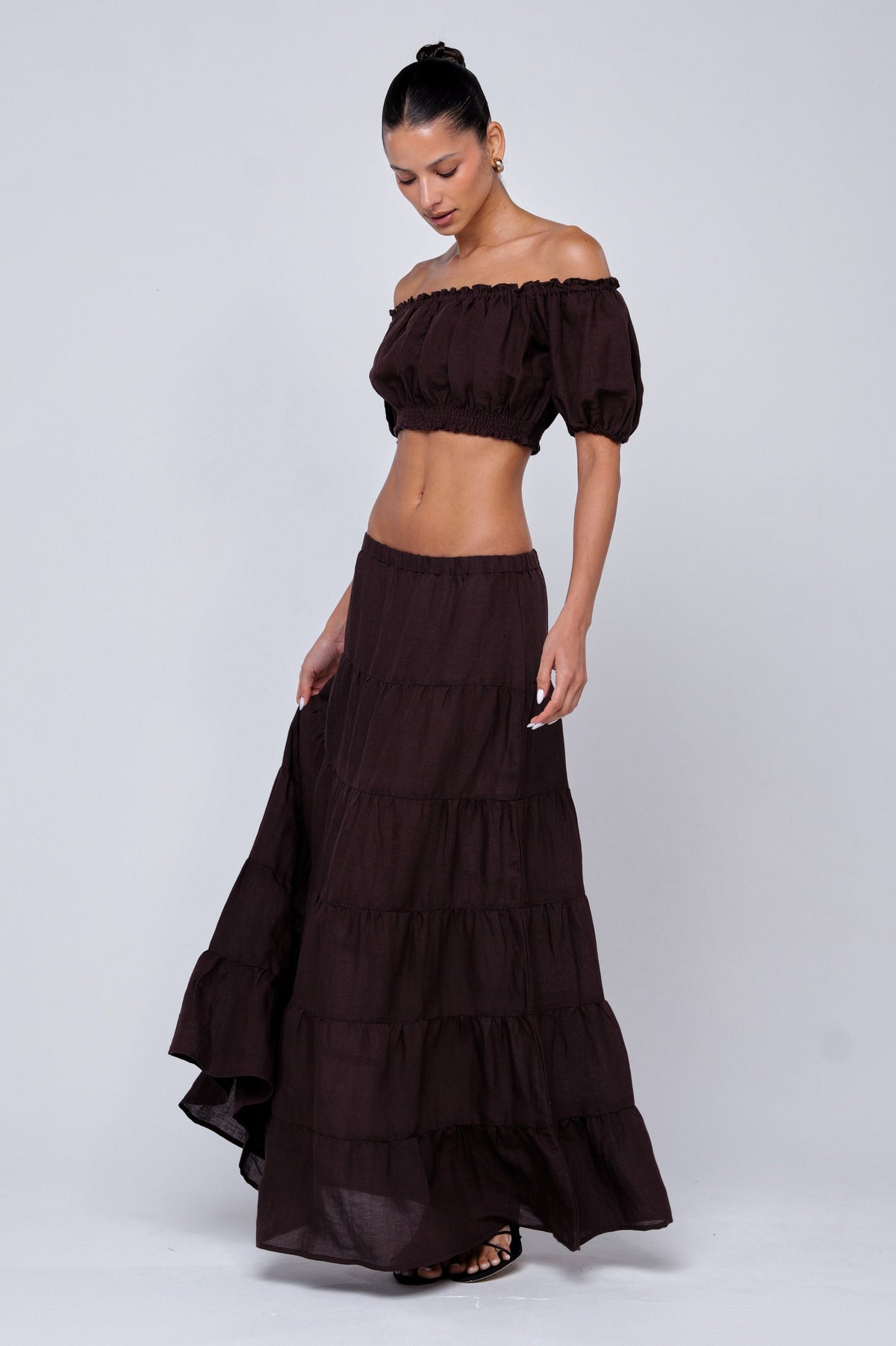 This is an image of Juliana Skirt in Brown Linen - RESA featuring a model wearing the dress