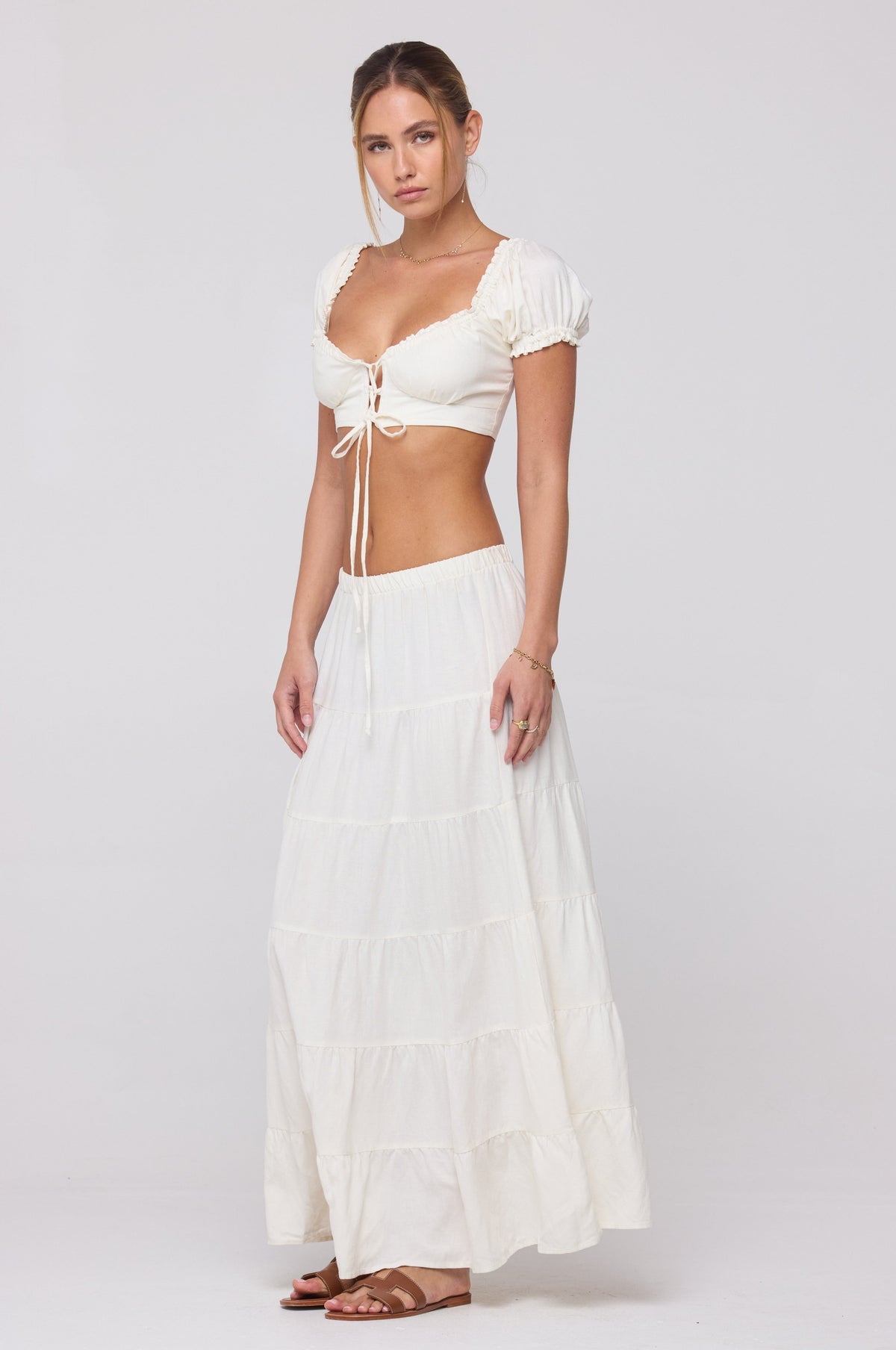 This is an image of Juliana Skirt in White Linen - RESA featuring a model wearing the dress