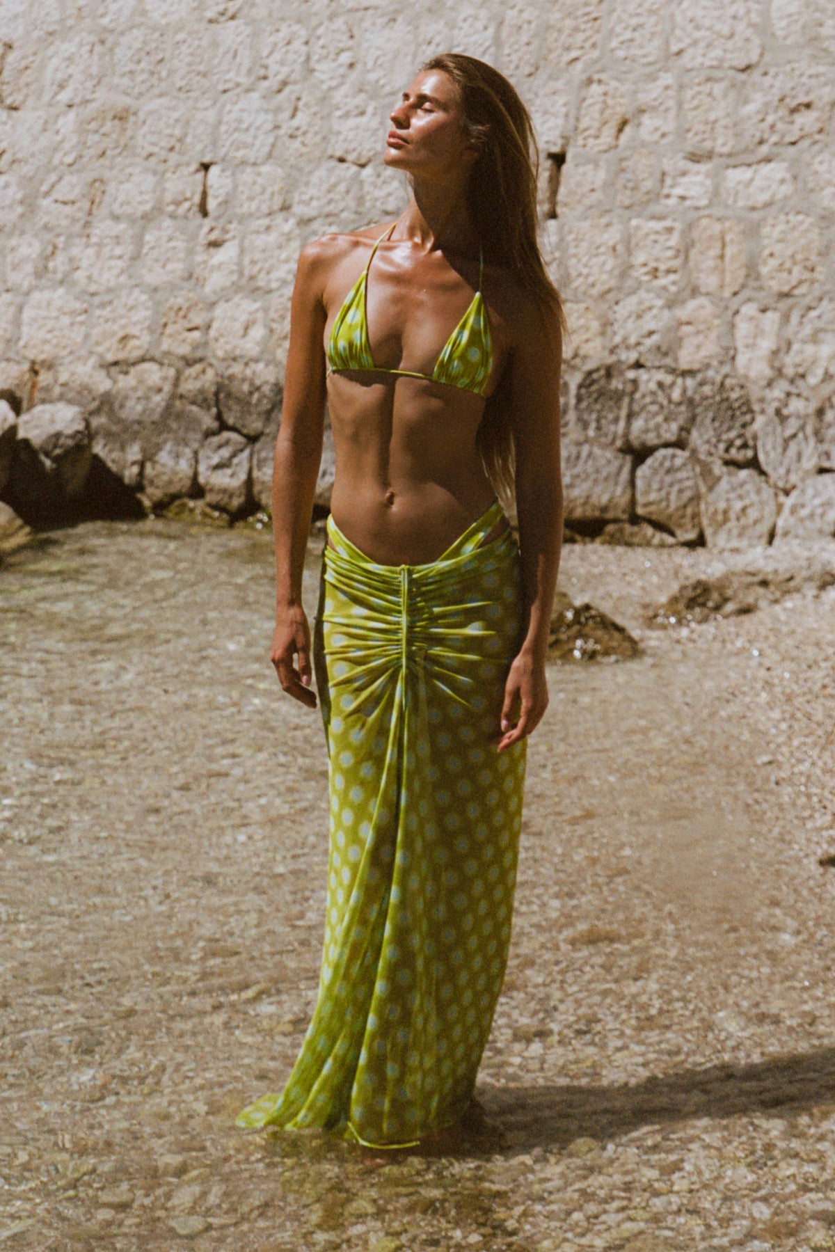 This is an image of Kyle in Luma - RESA featuring a model wearing the dress