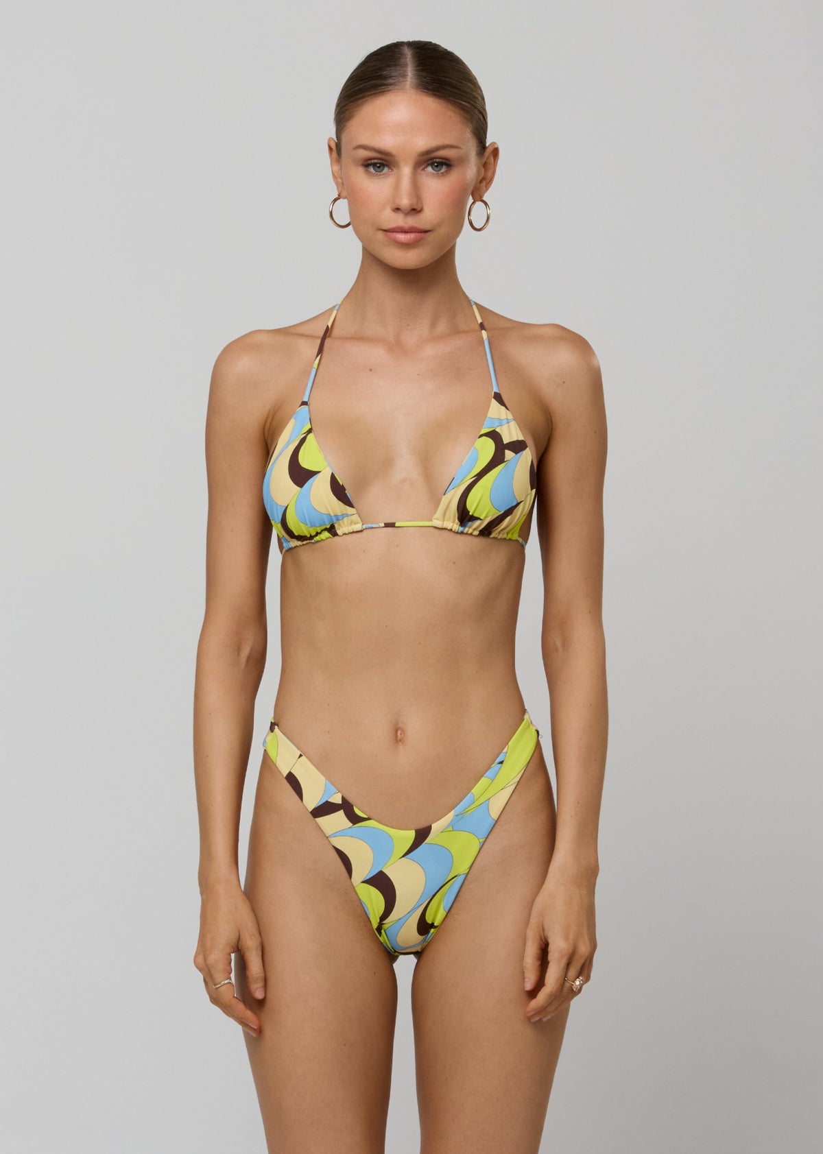 This is an image of Kyle Triangle Bikini Top in Palm Royale - RESA featuring a model wearing the dress