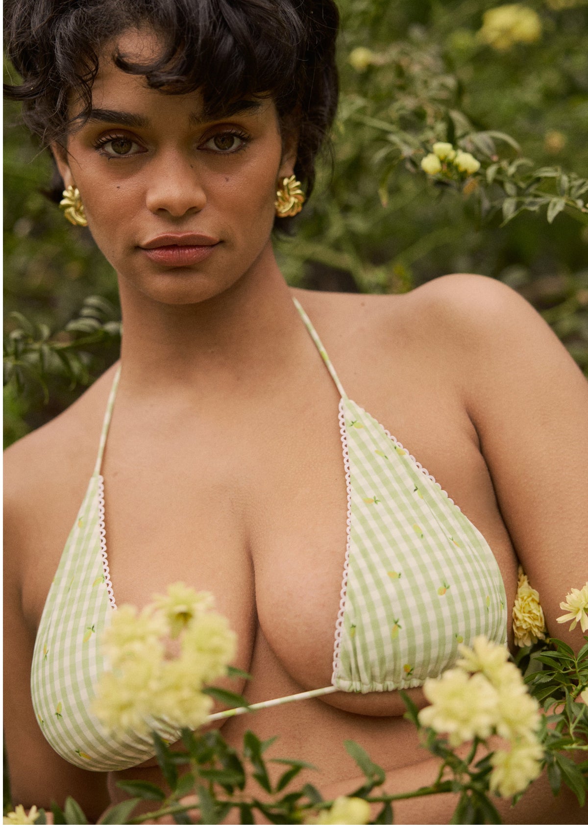 This is an image of Kyle Triangle Bikini Top in Zest - RESA featuring a model wearing the dress