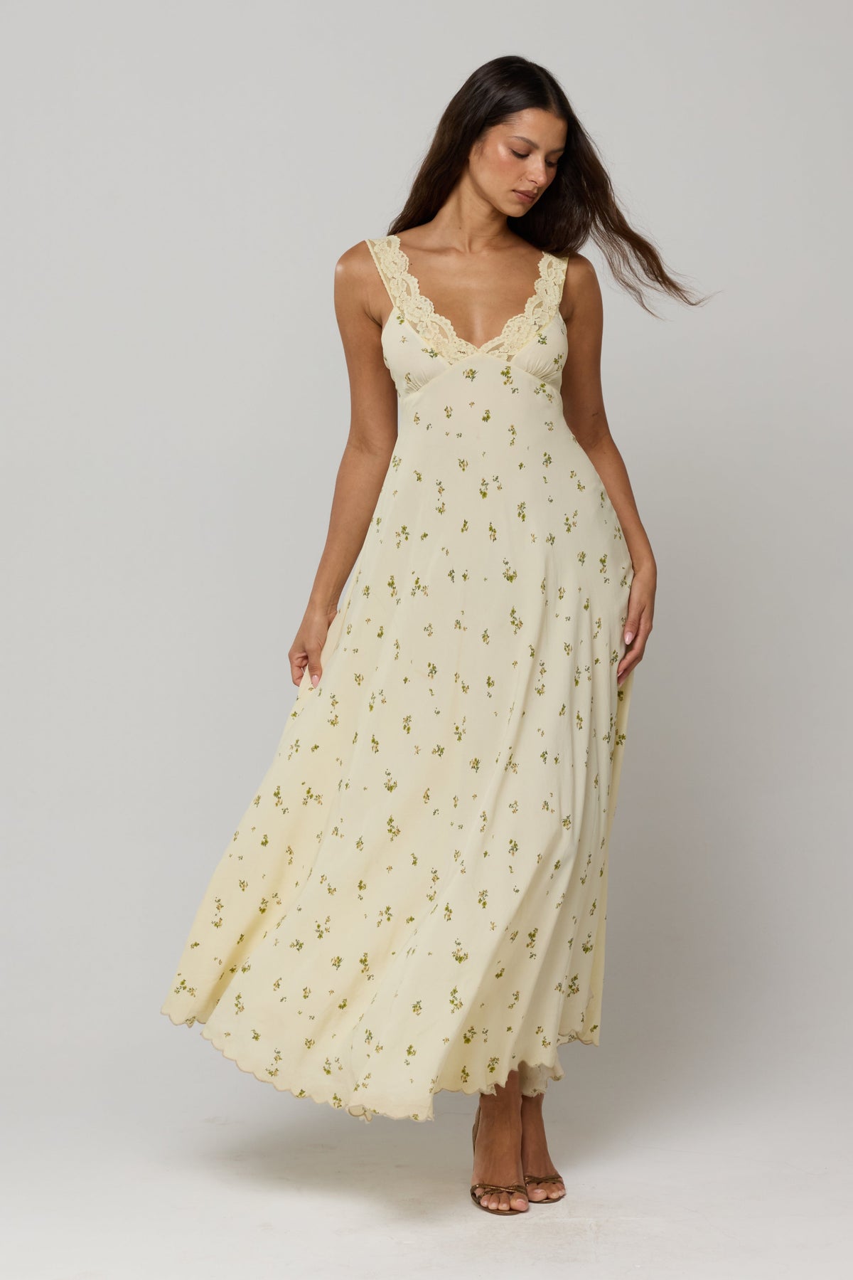 This is an image of Laney Dress in Beurre - RESA featuring a model wearing the dress