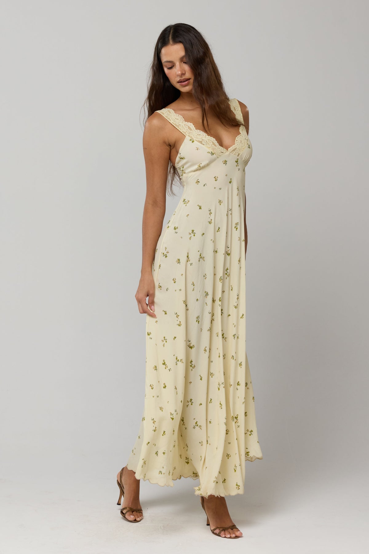This is an image of Laney Dress in Beurre - RESA featuring a model wearing the dress