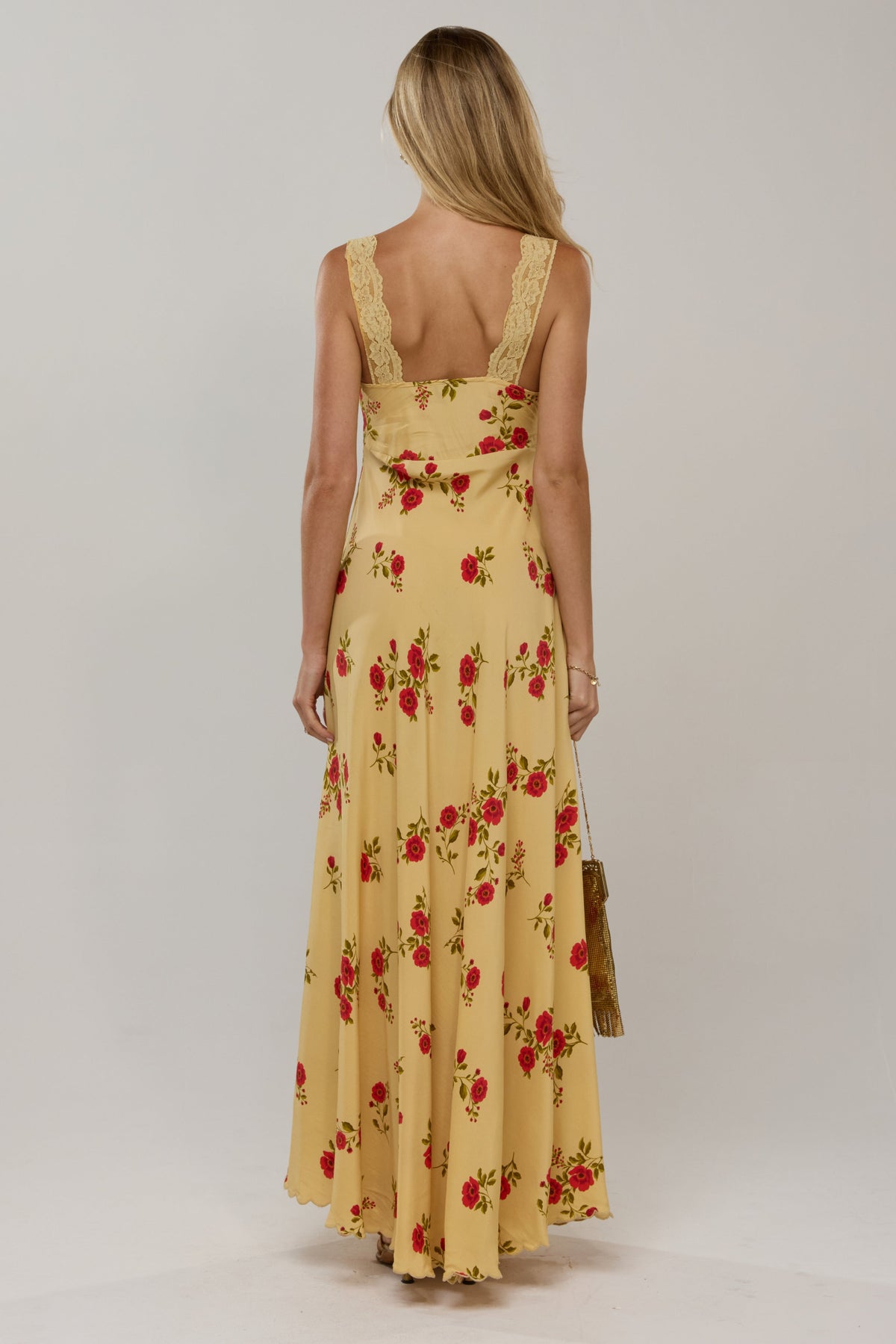 This is an image of Laney Dress in Saffron - RESA featuring a model wearing the dress