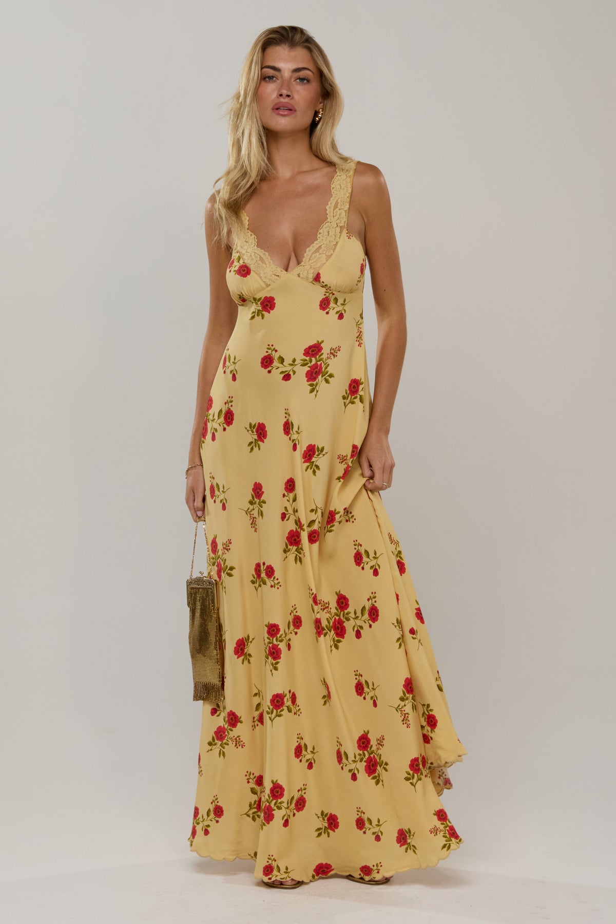 This is an image of Laney Dress in Saffron - RESA featuring a model wearing the dress