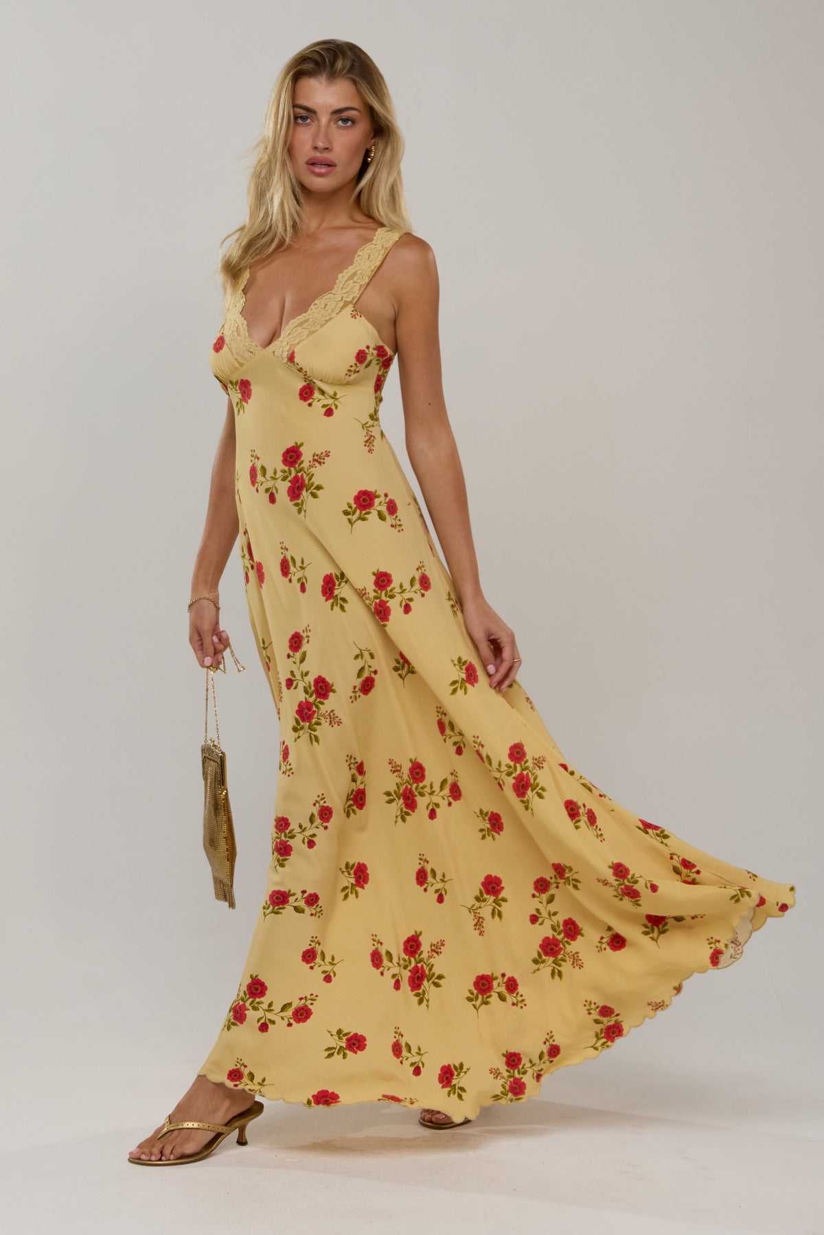 This is an image of Laney Dress in Saffron - RESA featuring a model wearing the dress