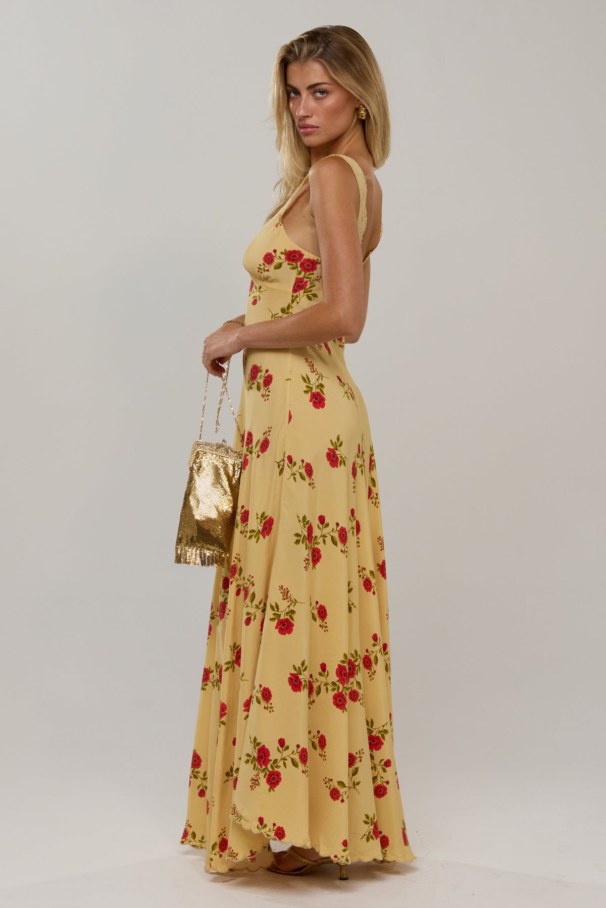 This is an image of Laney Dress in Saffron - RESA featuring a model wearing the dress