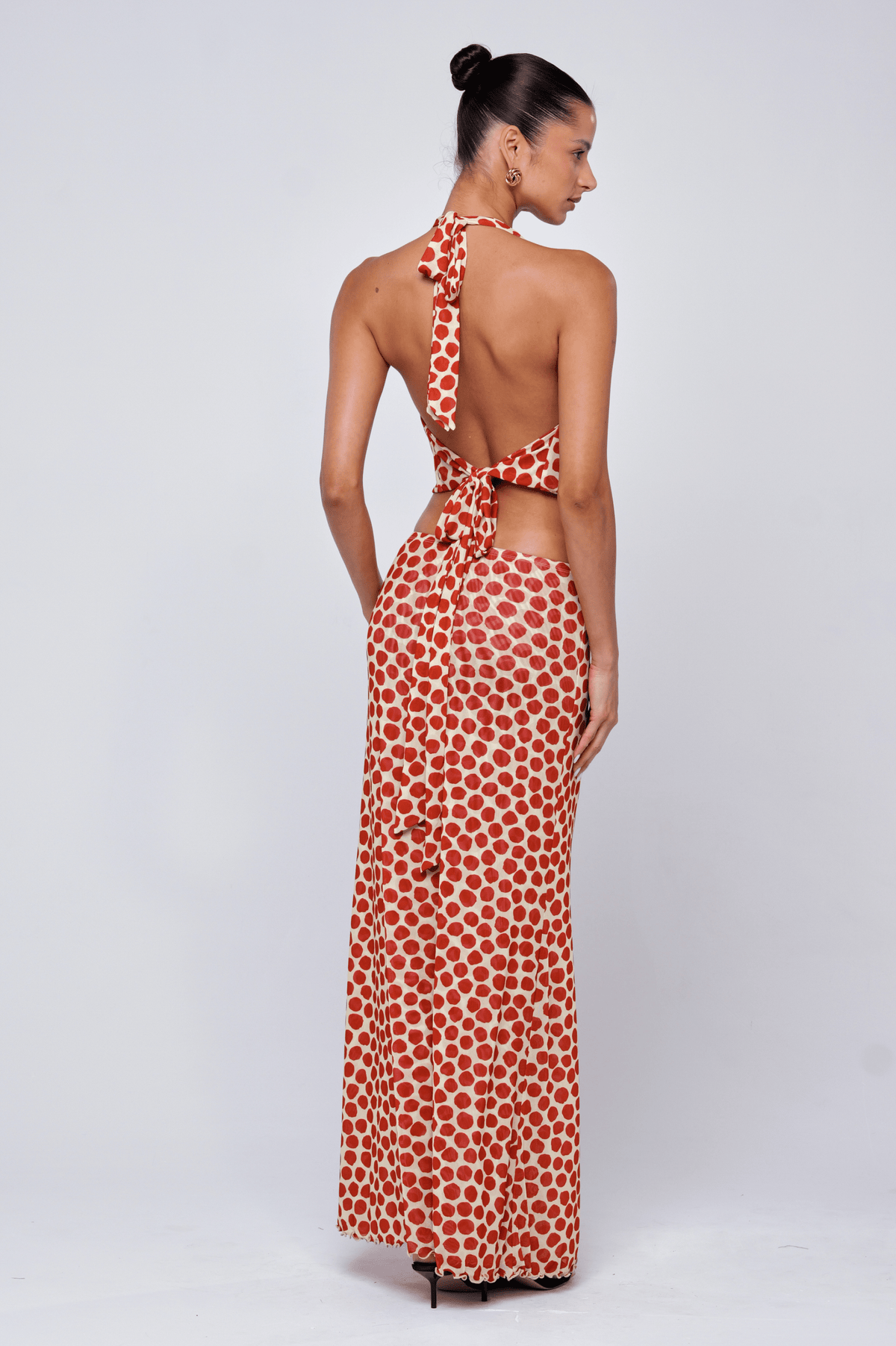 This is an image of Lea Top in Campari - RESA featuring a model wearing the dress