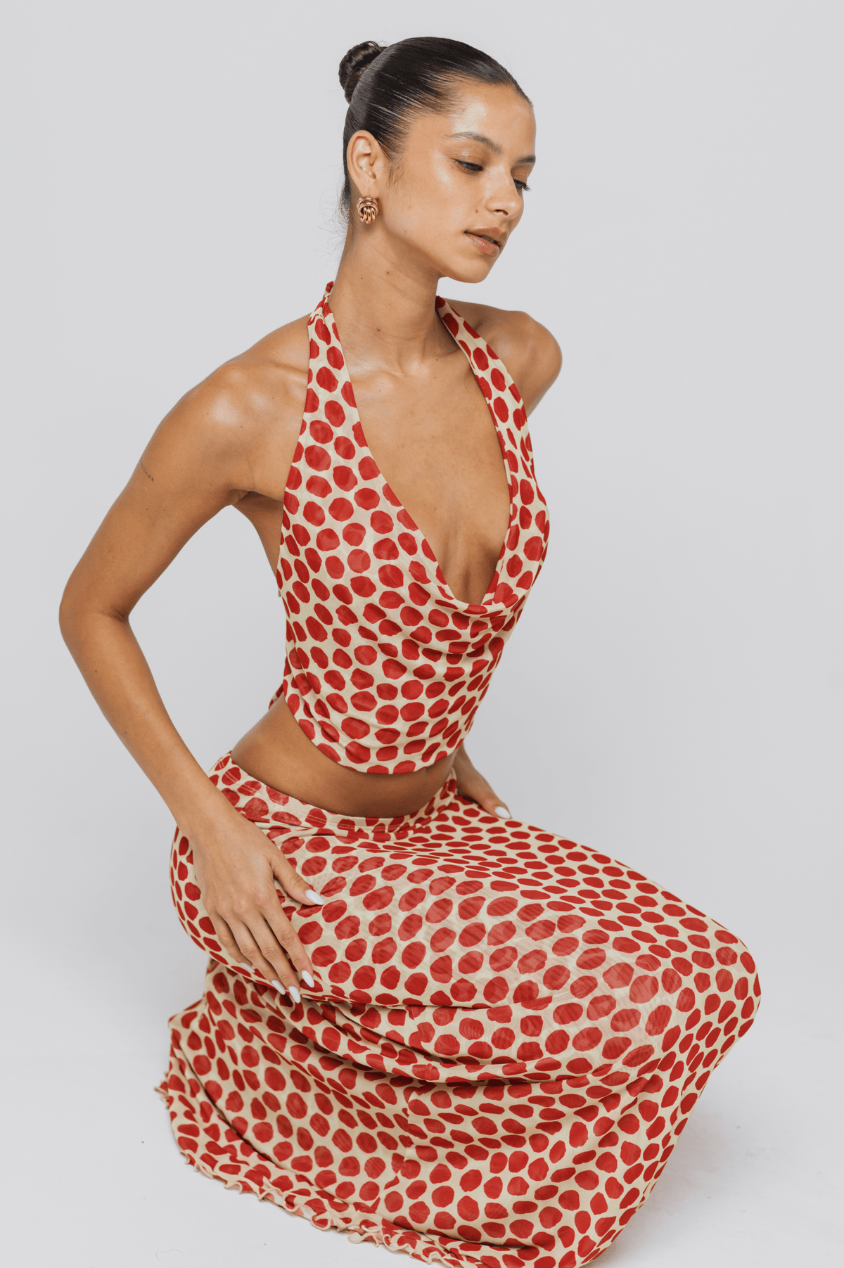 This is an image of Lea Top in Campari - RESA featuring a model wearing the dress