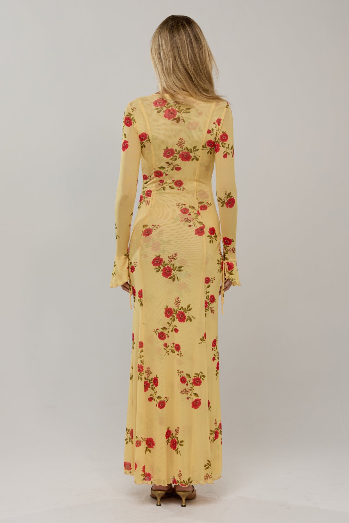 This is an image of Lennon in Saffron - RESA featuring a model wearing the dress