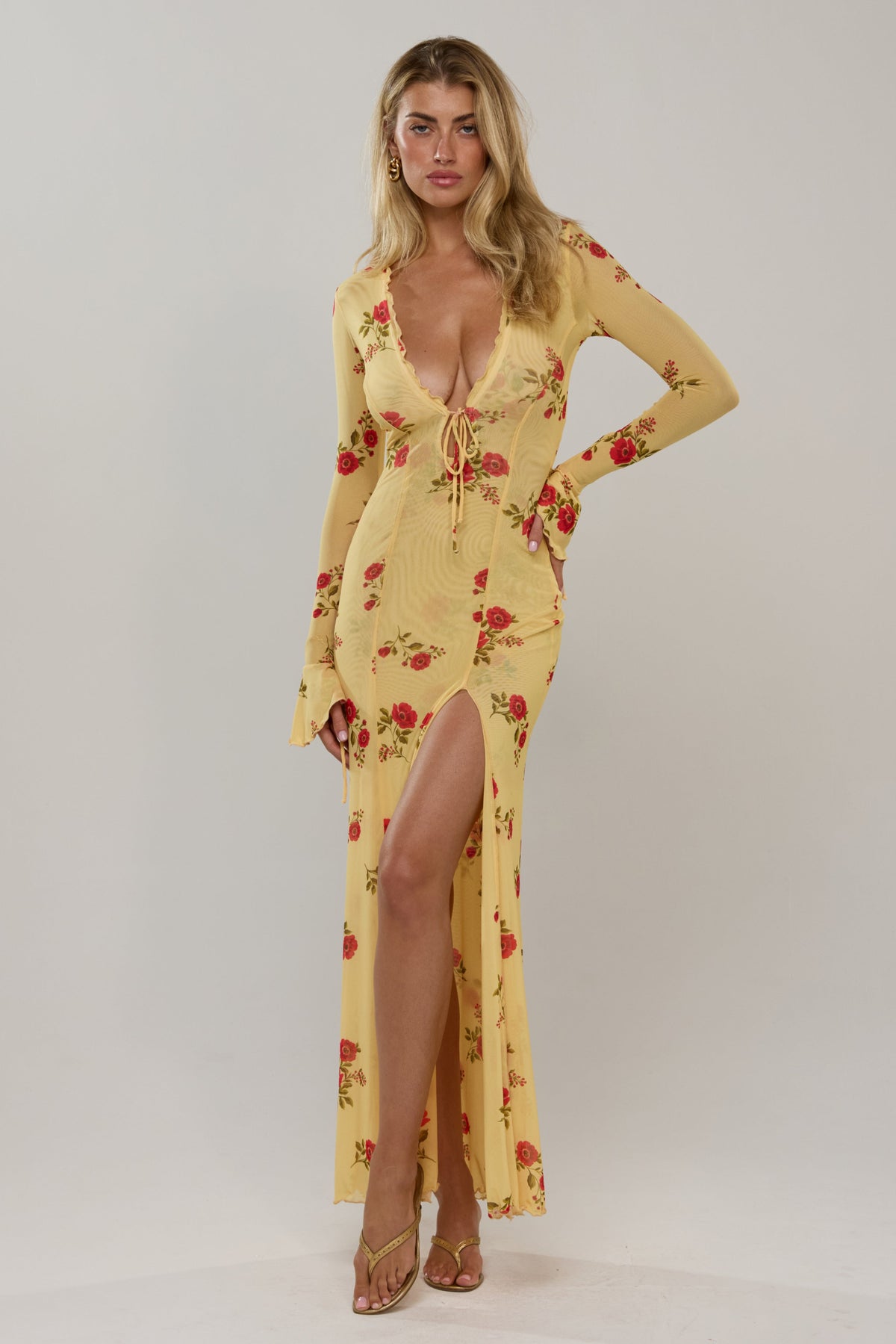 This is an image of Lennon in Saffron - RESA featuring a model wearing the dress