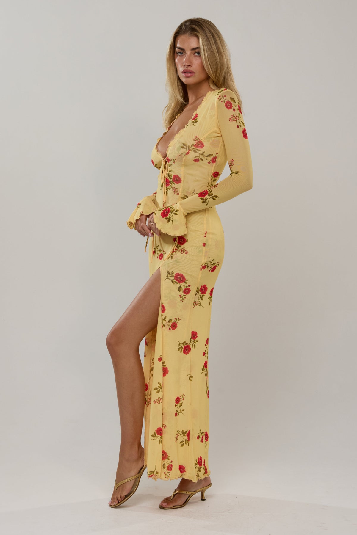 This is an image of Lennon in Saffron - RESA featuring a model wearing the dress