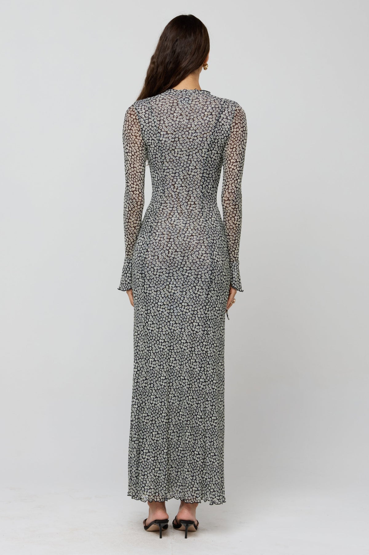 This is an image of Lennon Maxi in Flores - RESA featuring a model wearing the dress