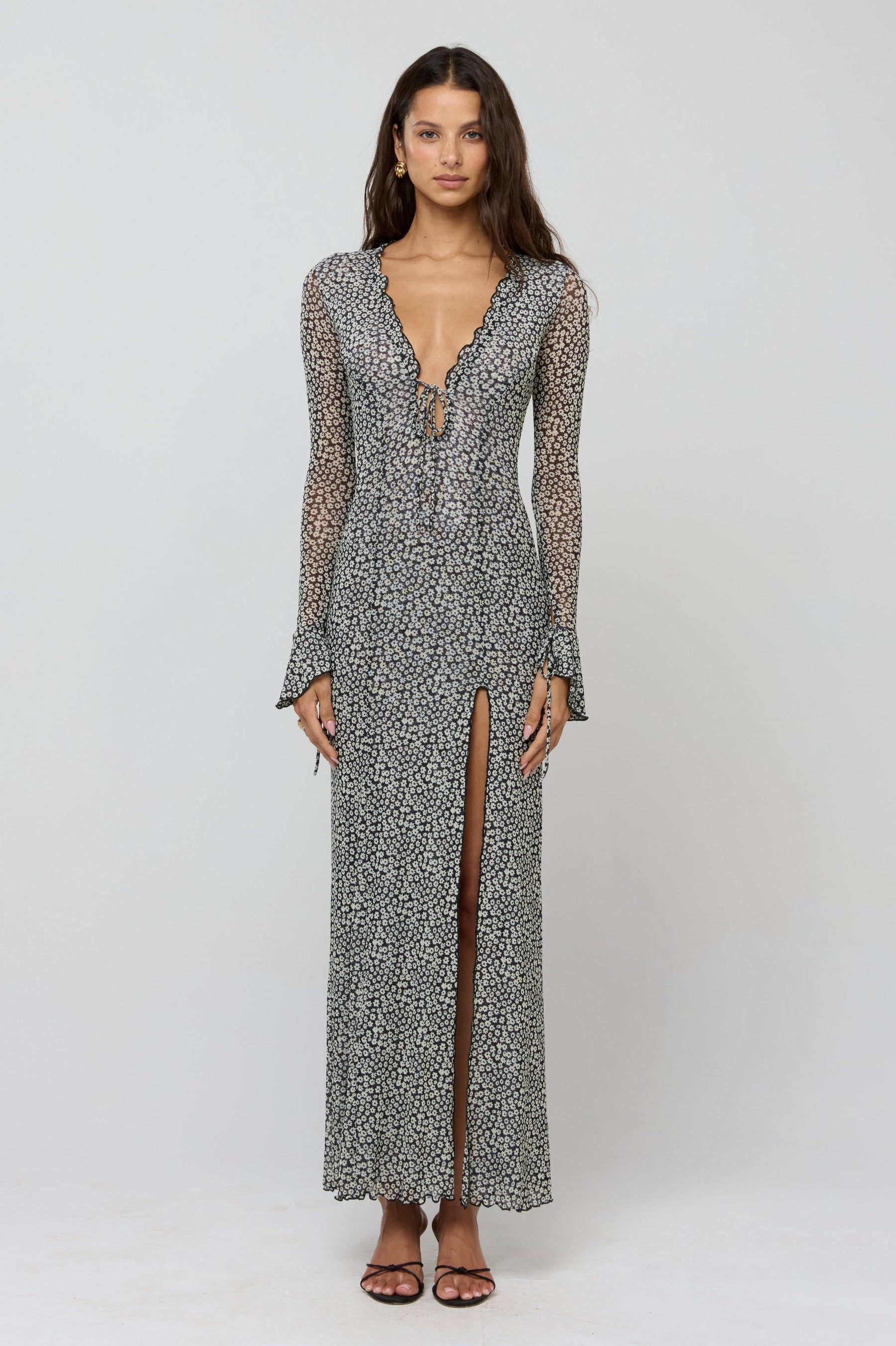 This is an image of Lennon Maxi in Flores - RESA featuring a model wearing the dress