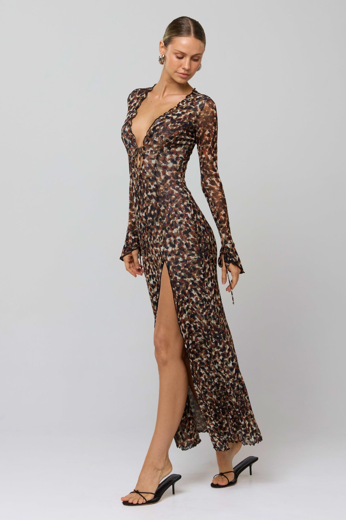 This is an image of Lennon Maxi in Terra - RESA featuring a model wearing the dress