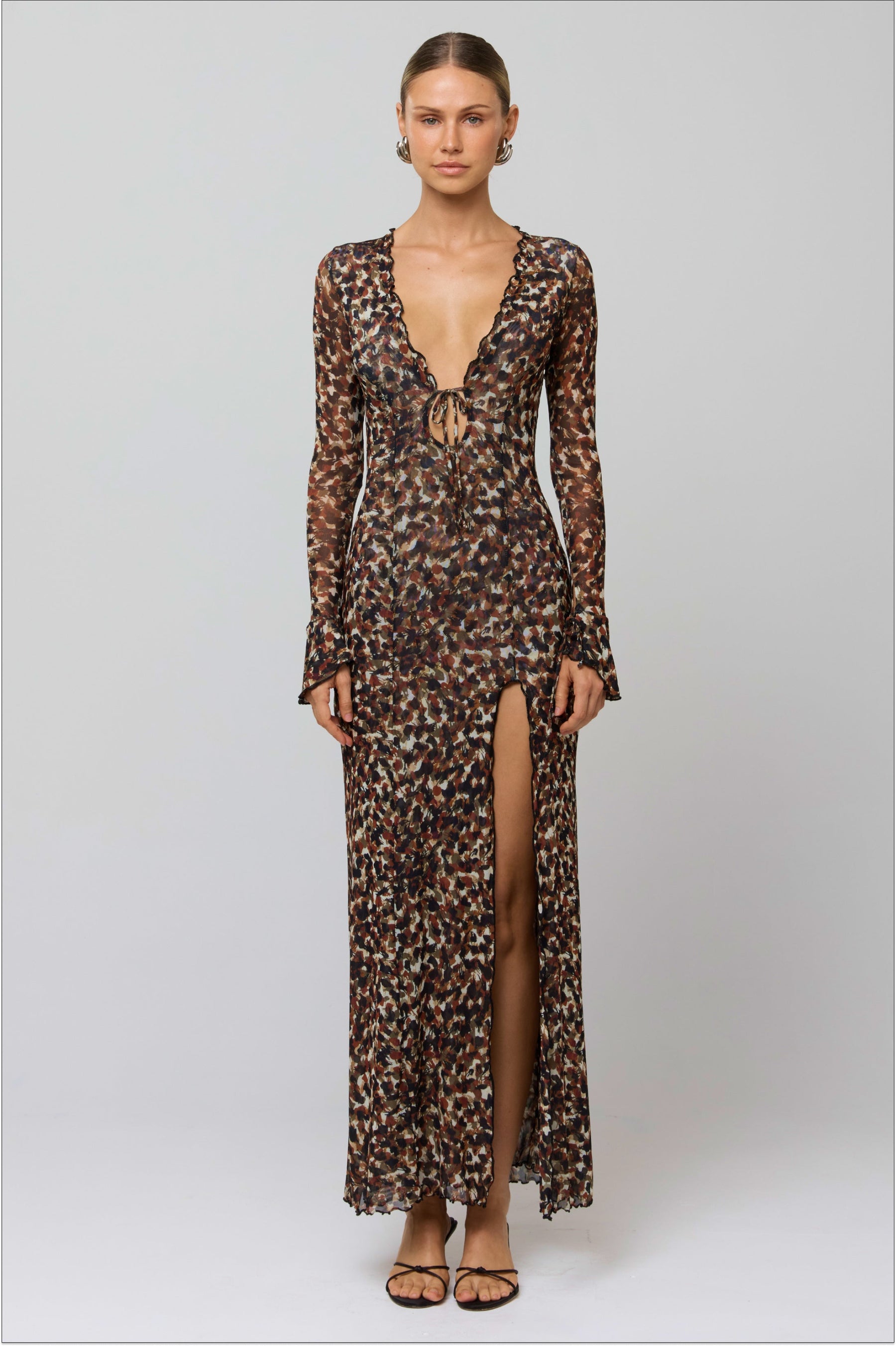 This is an image of Lennon Maxi in Terra - RESA featuring a model wearing the dress