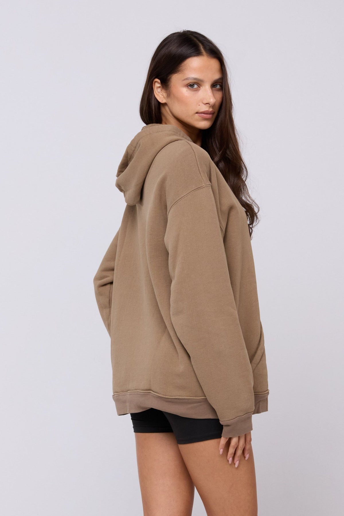 This is an image of Leo Hoodie in Moss - RESA featuring a model wearing the dress