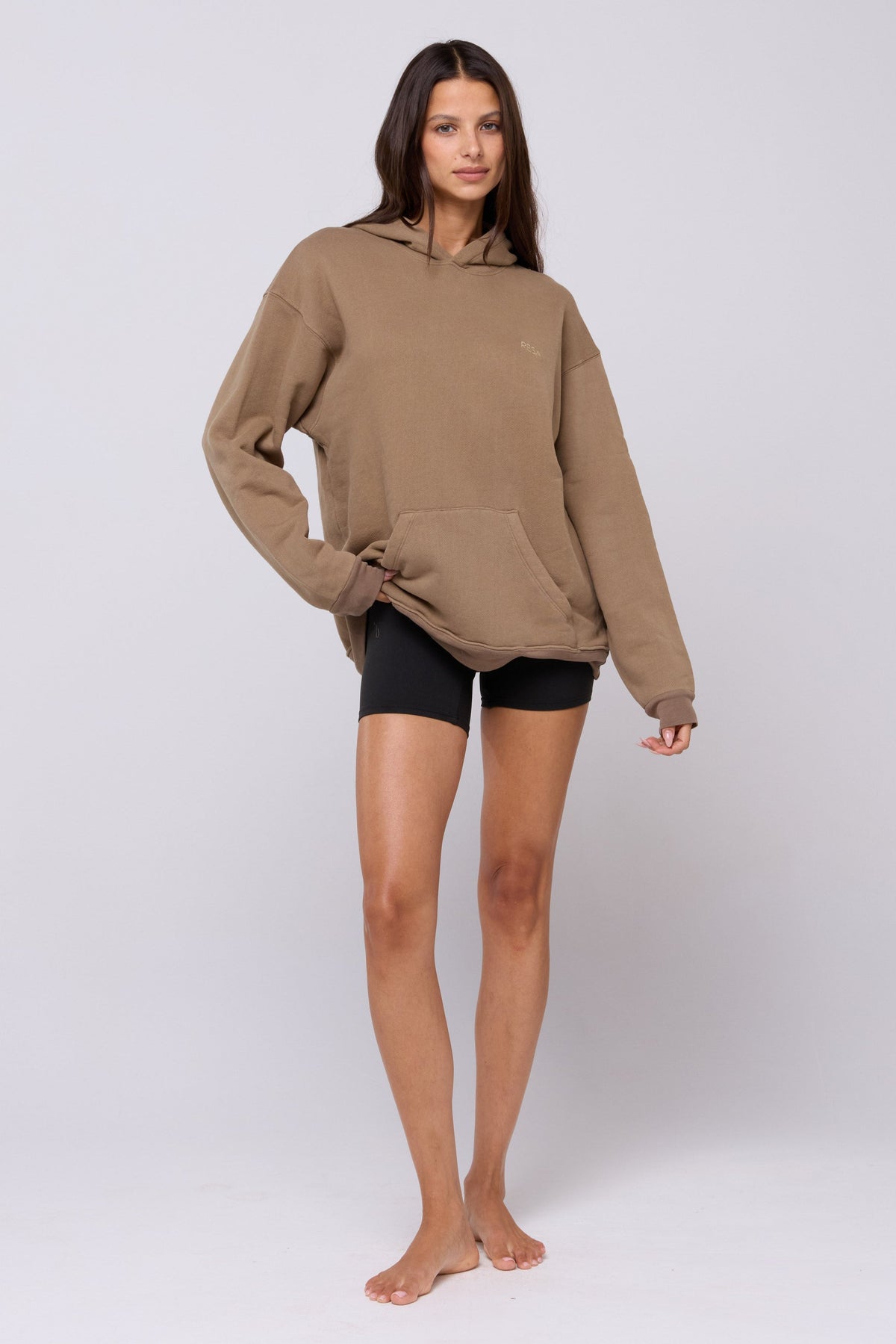 This is an image of Leo Hoodie in Moss - RESA featuring a model wearing the dress