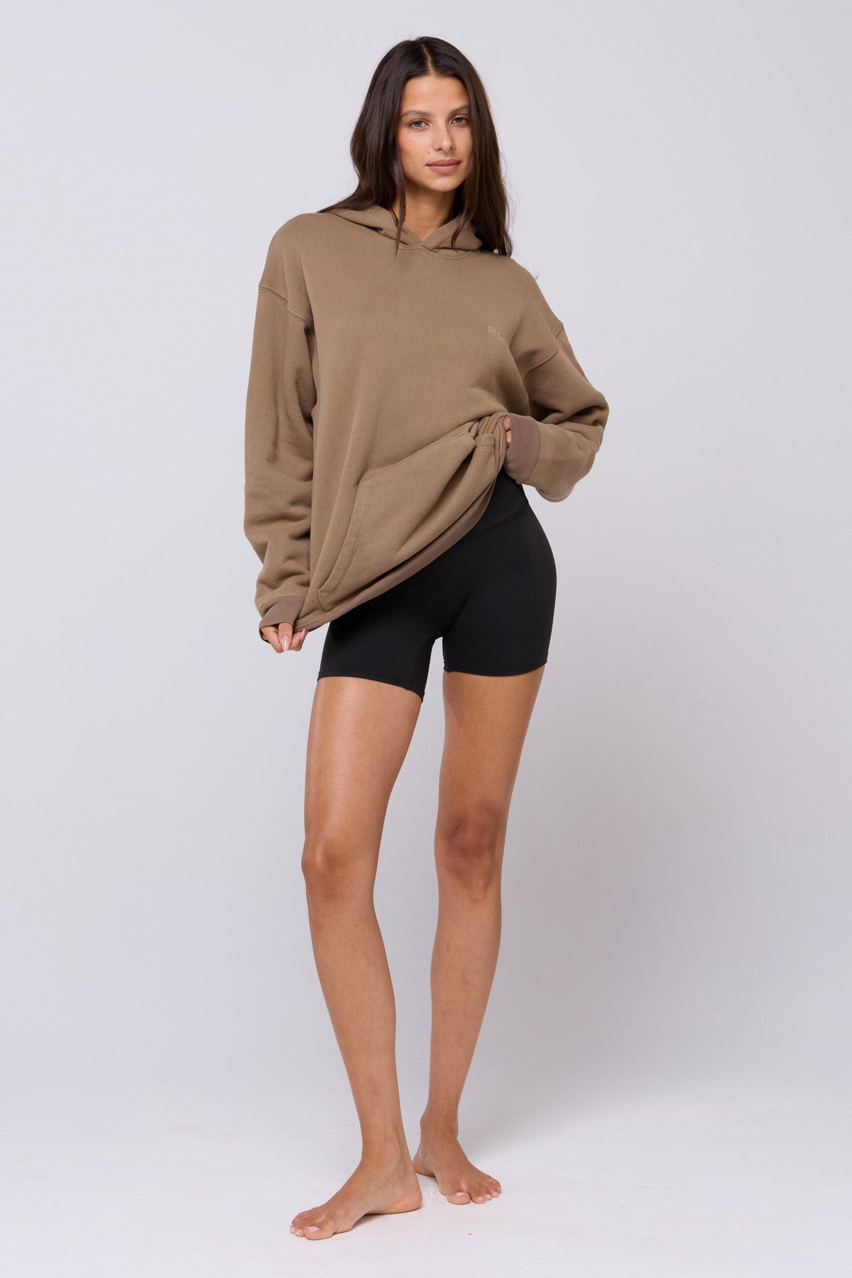 This is an image of Leo Hoodie in Moss - RESA featuring a model wearing the dress