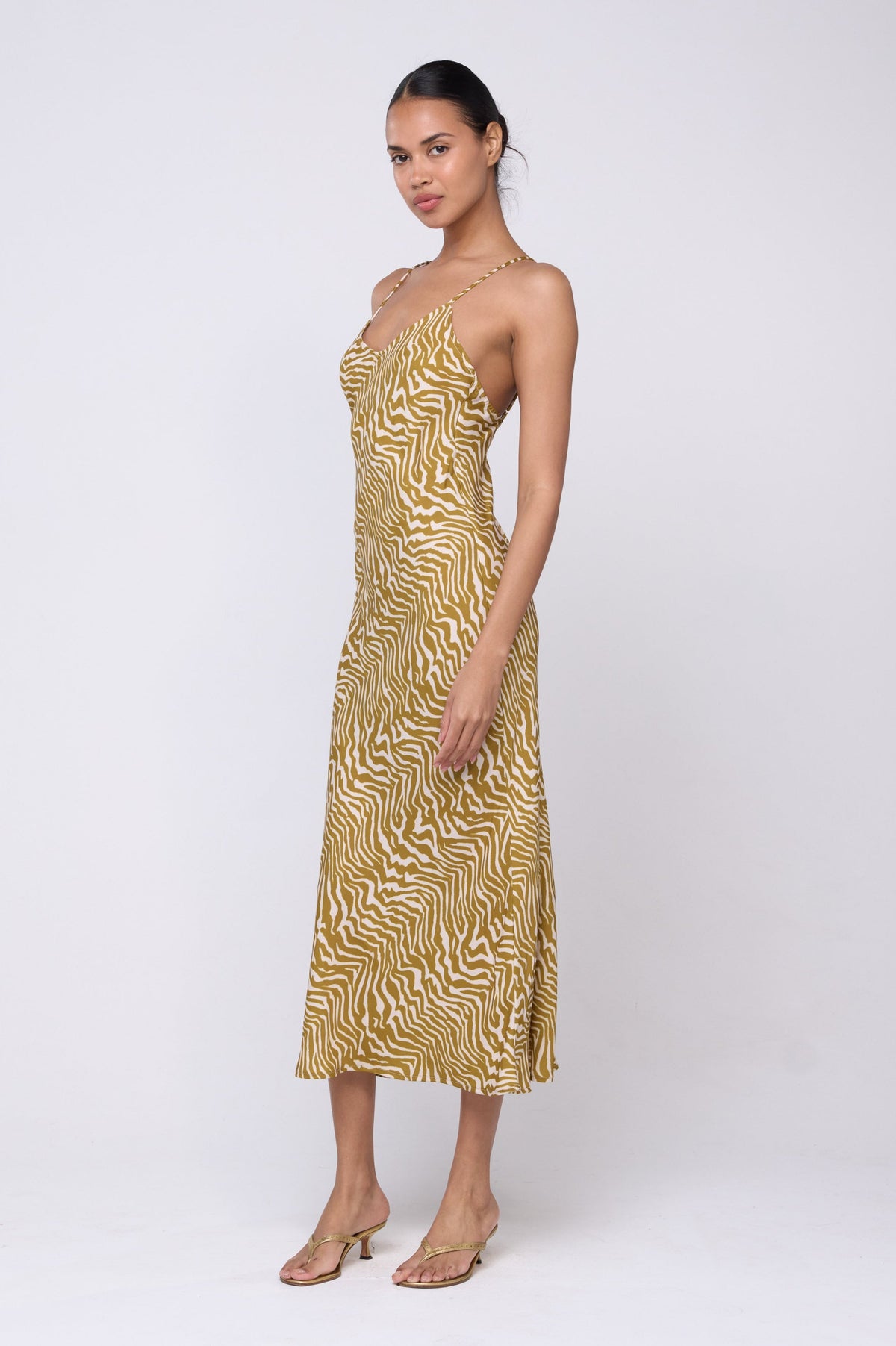 This is an image of Lily Slip in Kuma - Archive - RESA featuring a model wearing the dress