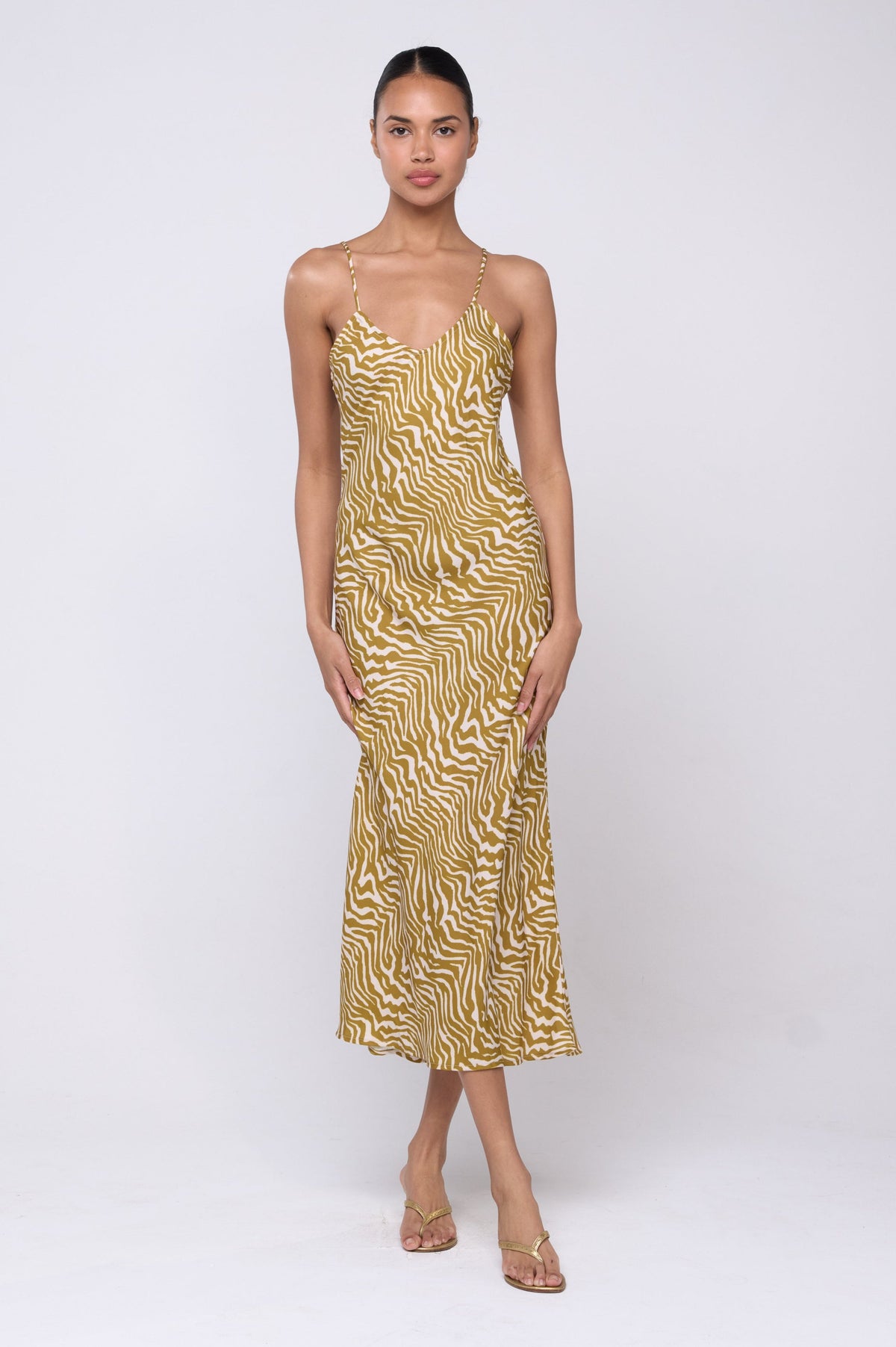 This is an image of Lily Slip in Kuma - Archive - RESA featuring a model wearing the dress