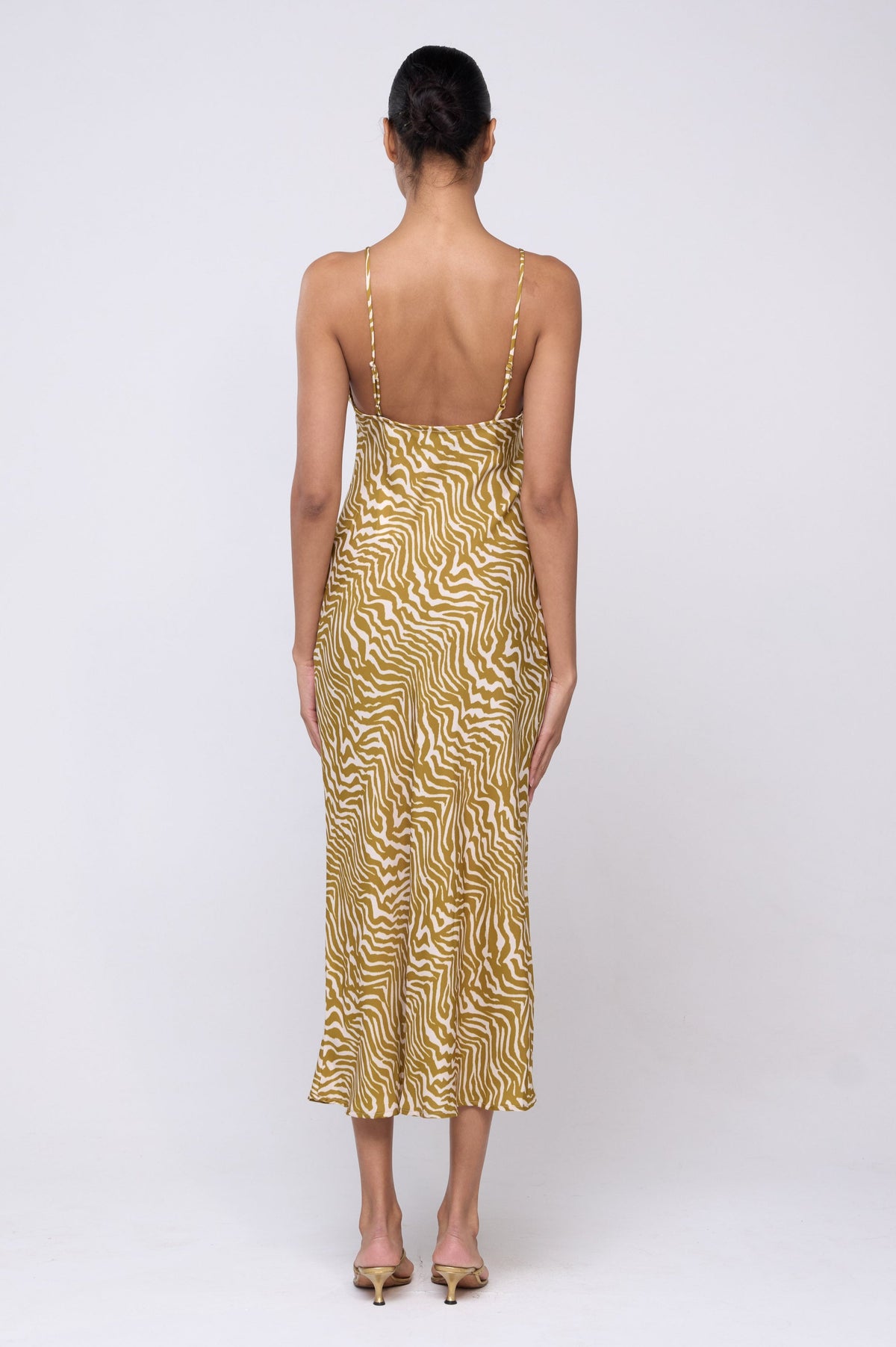 This is an image of Lily Slip in Kuma - Archive - RESA featuring a model wearing the dress