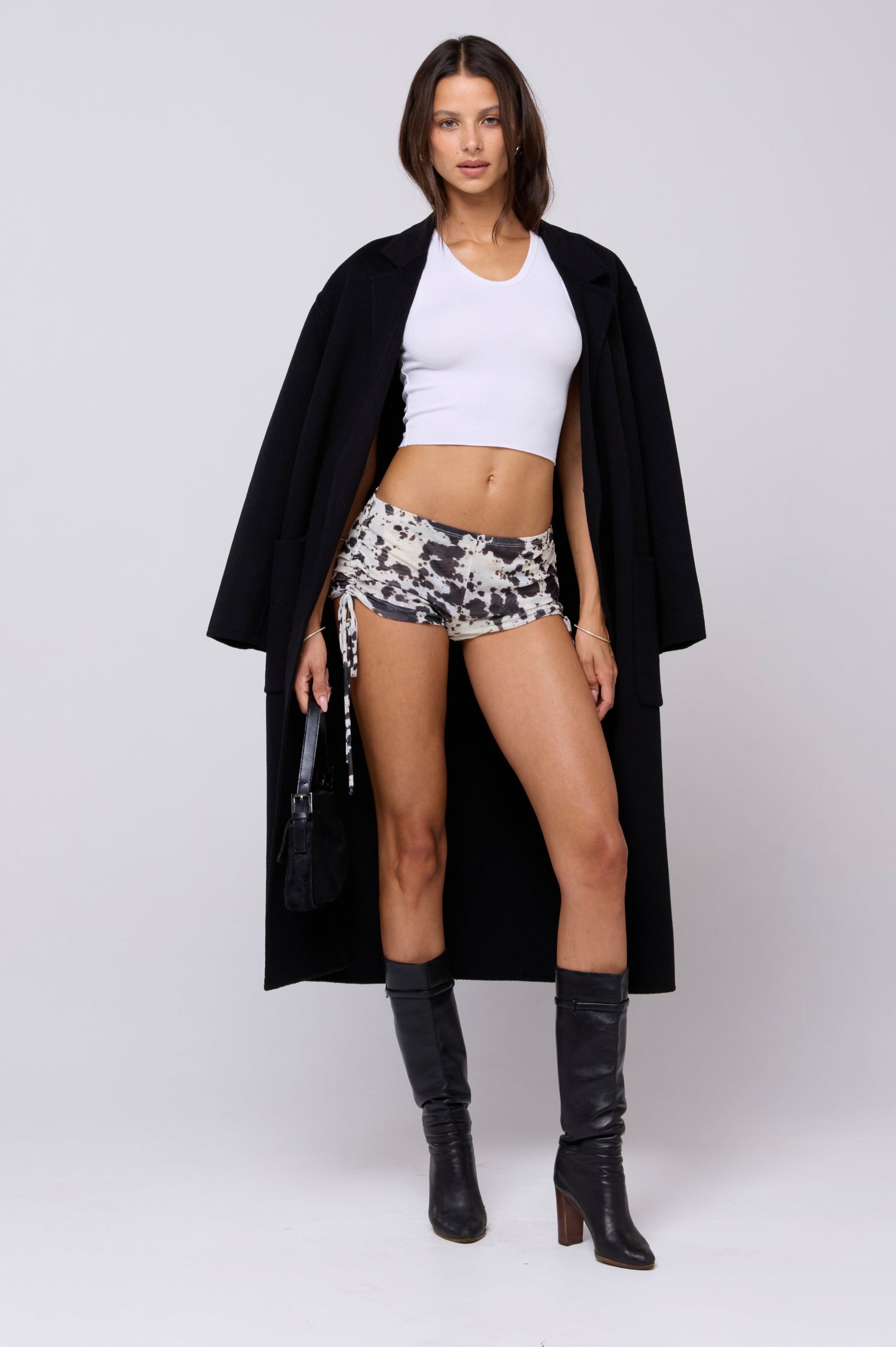 This is an image of Lina Short in Hide - RESA featuring a model wearing the dress