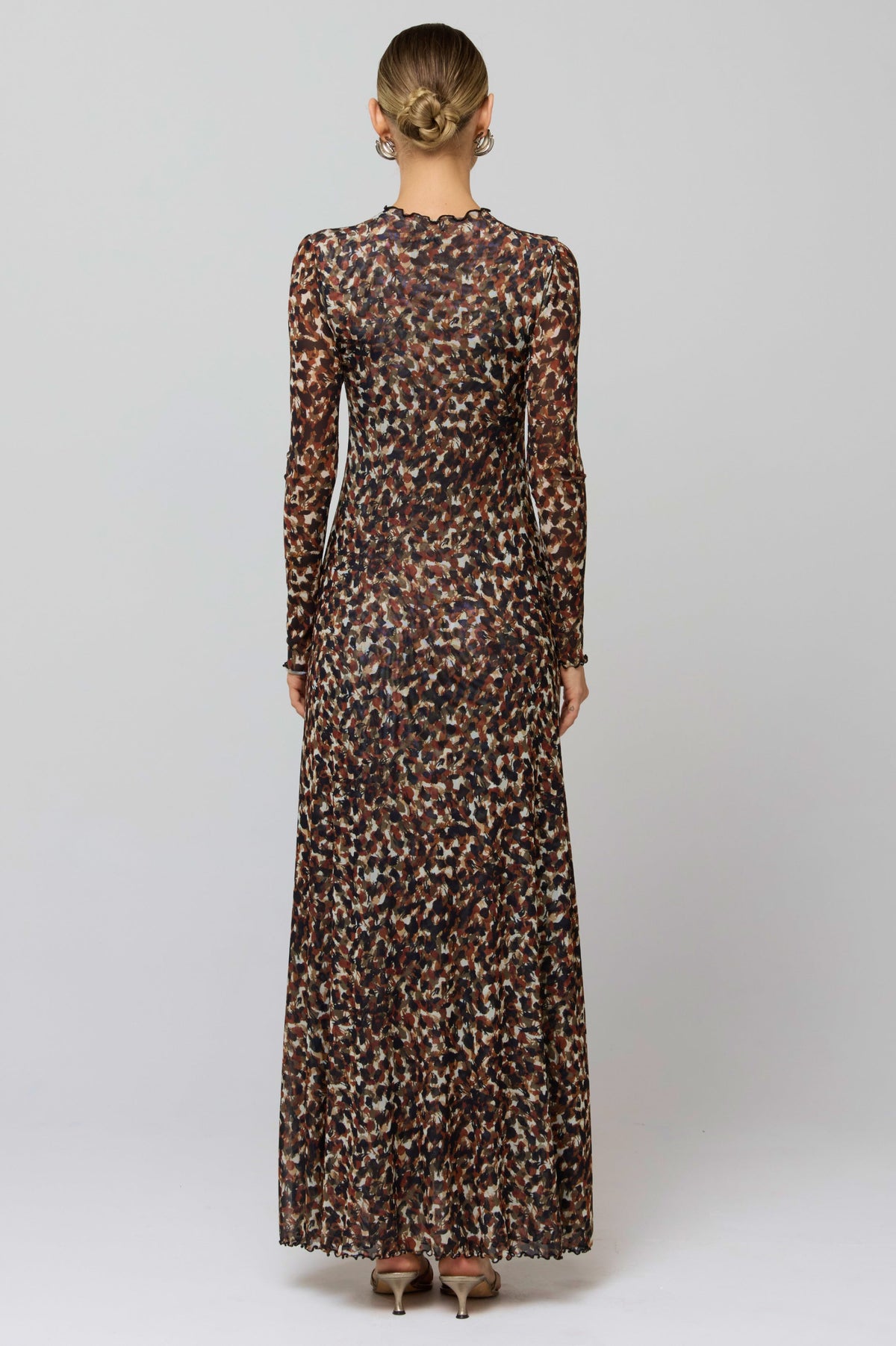 This is an image of Lyon Dress in Terra - RESA featuring a model wearing the dress