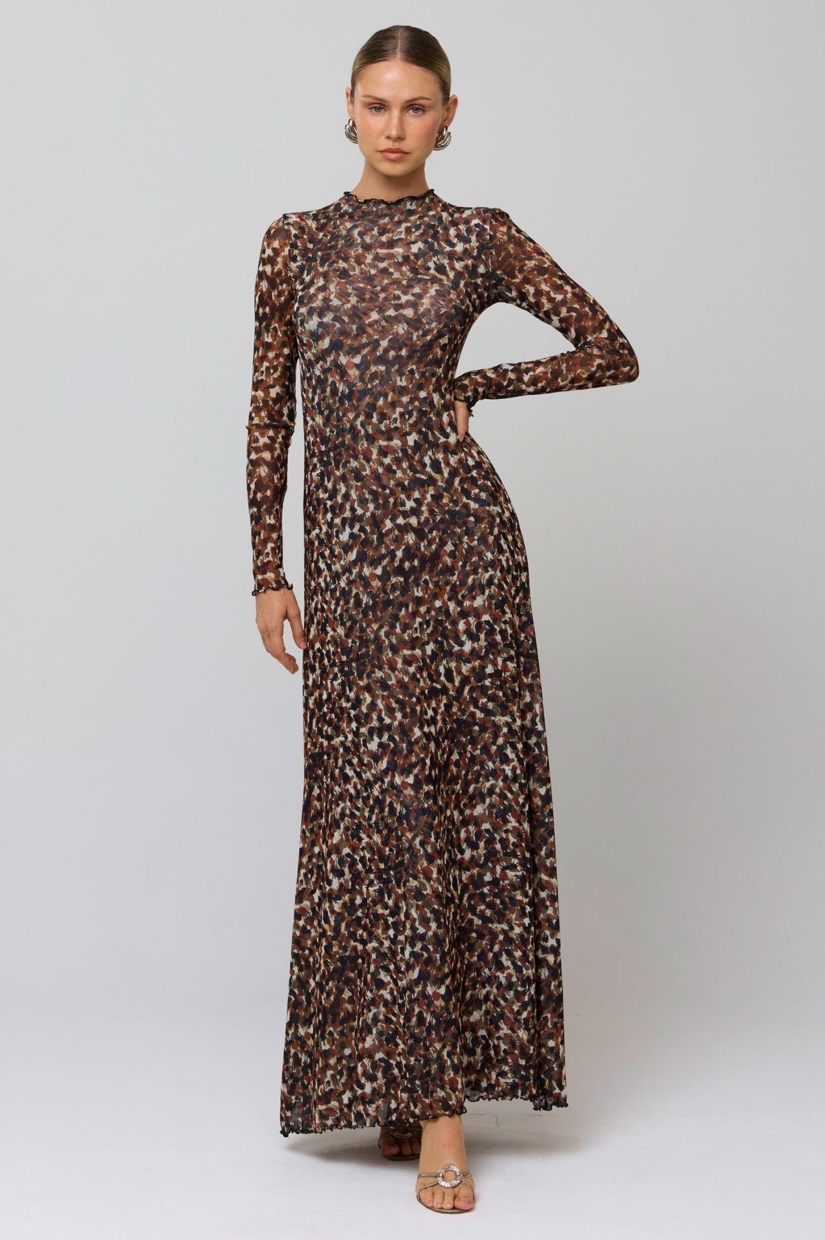 This is an image of Lyon Dress in Terra - RESA featuring a model wearing the dress