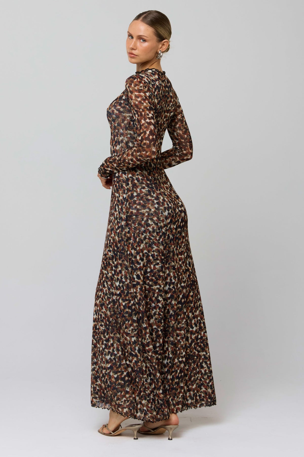 This is an image of Lyon Dress in Terra - RESA featuring a model wearing the dress