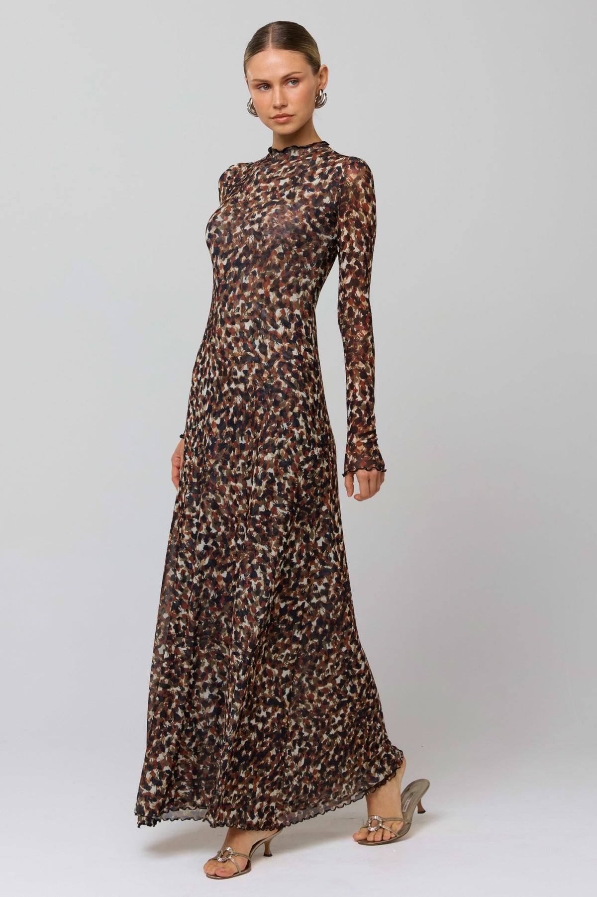 This is an image of Lyon Dress in Terra - RESA featuring a model wearing the dress