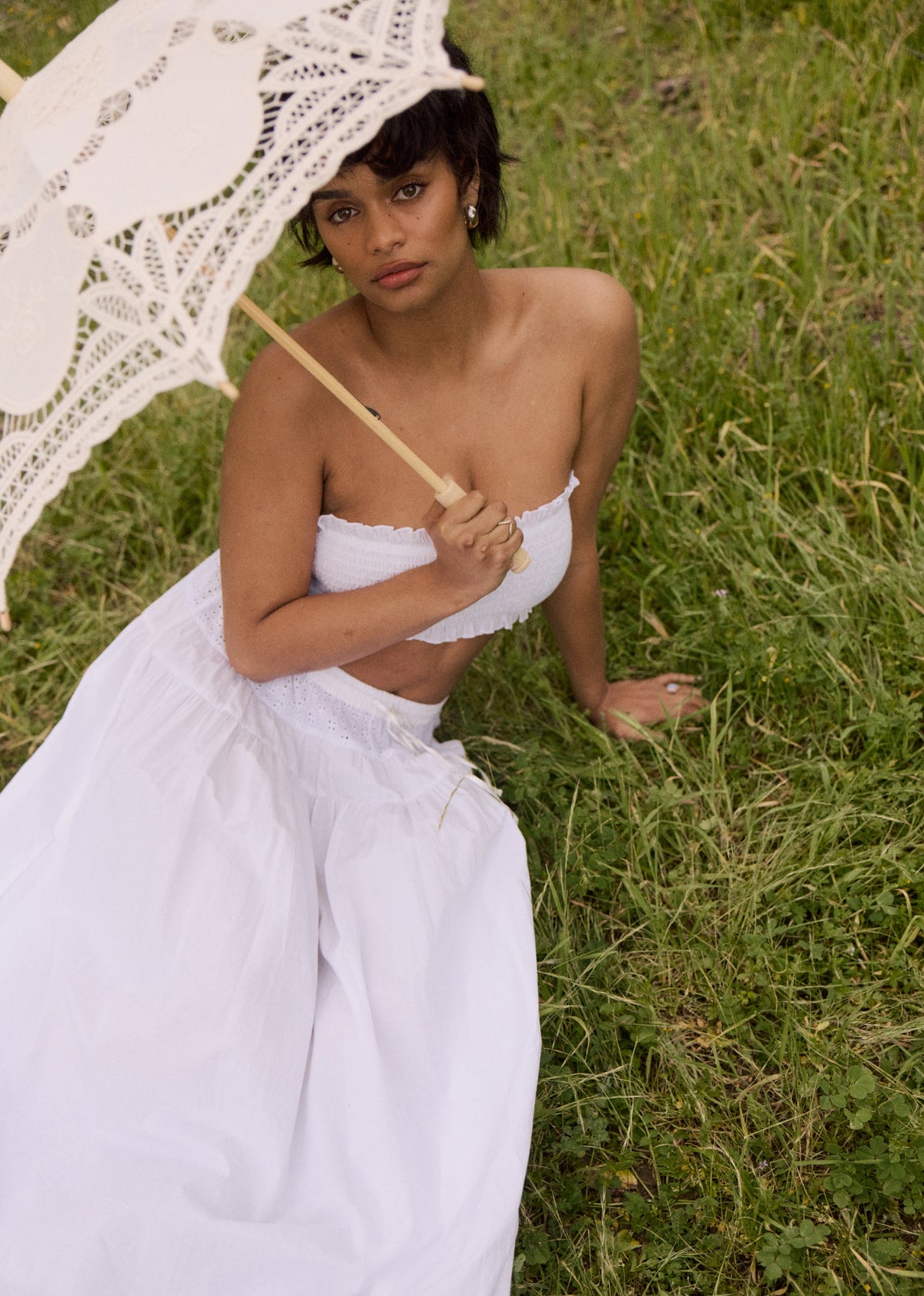 This is an image of Lyssa Set in White Eyelet - RESA featuring a model wearing the dress