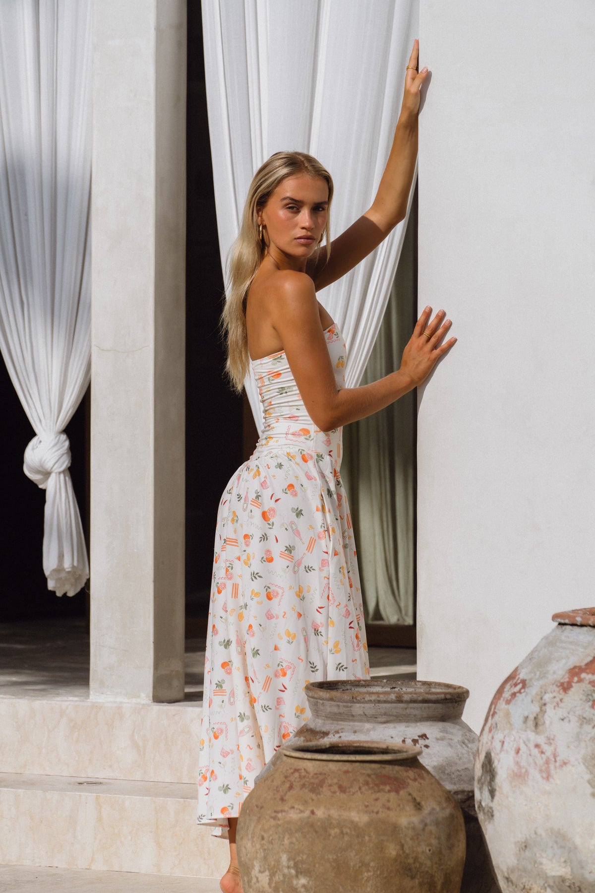 This is an image of Mackenzie Dress in Aperitivo - RESA featuring a model wearing the dress