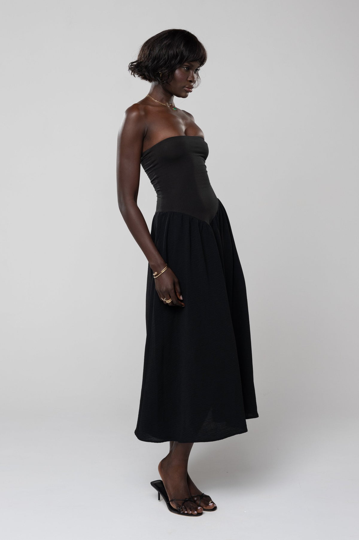 This is an image of Mackenzie Dress in Black - RESA featuring a model wearing the dress