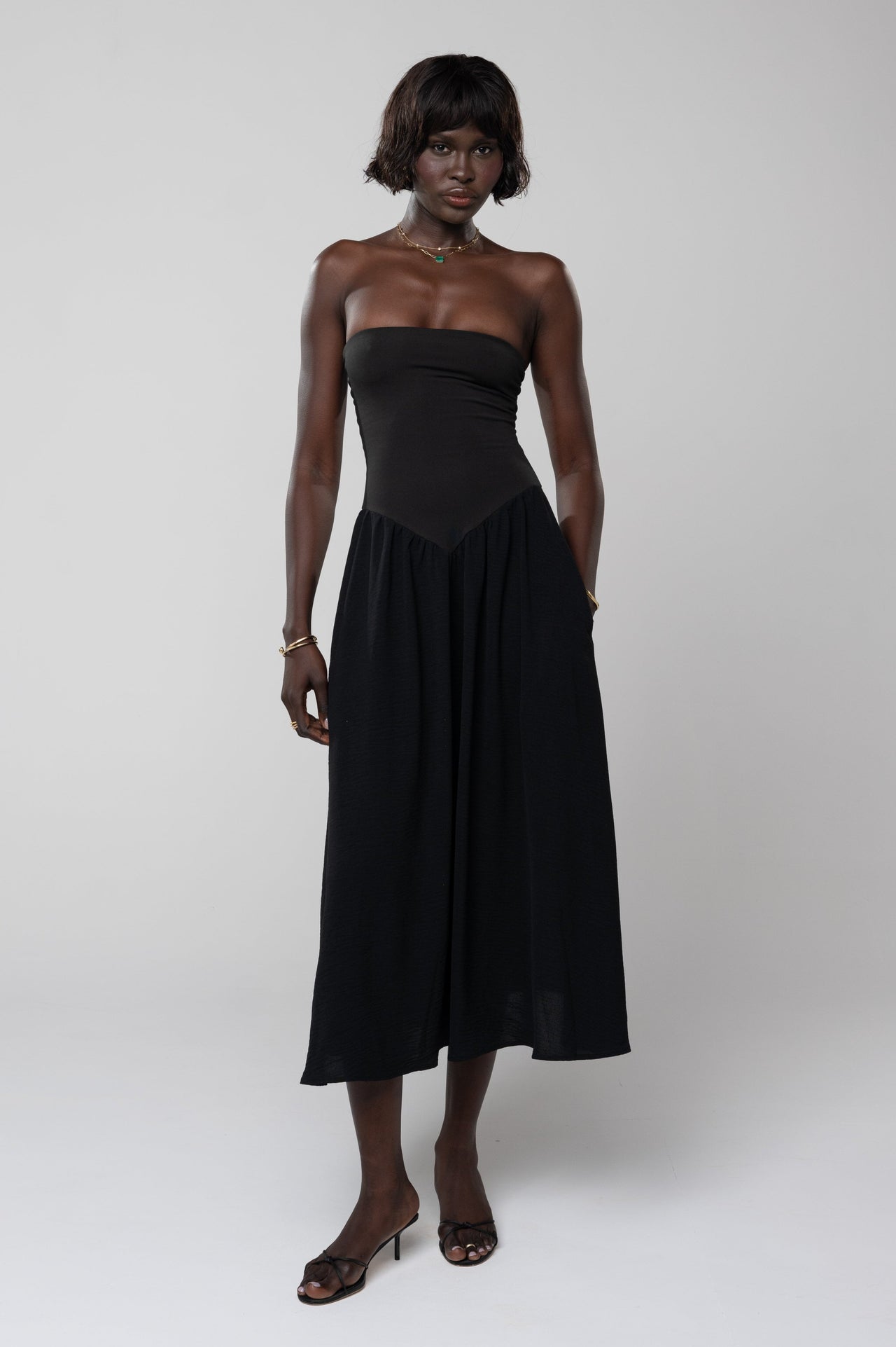 This is an image of Mackenzie Dress in Black - RESA featuring a model wearing the dress