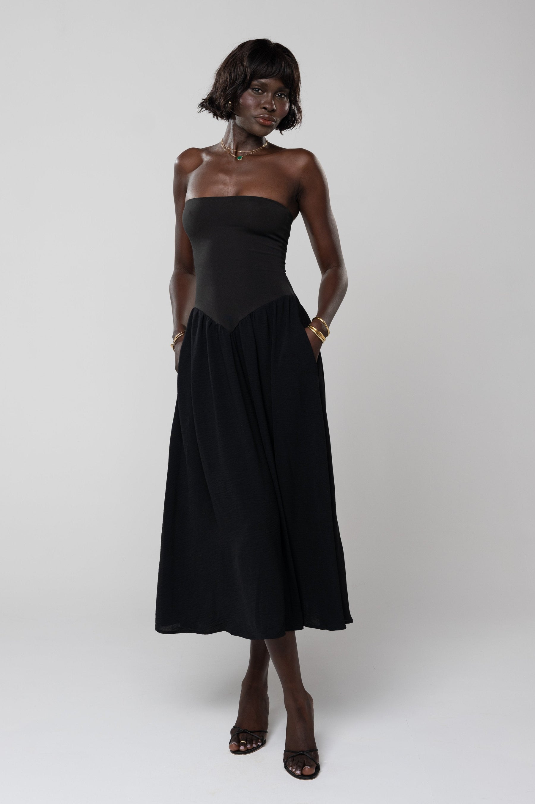 This is an image of Mackenzie Dress in Black - RESA featuring a model wearing the dress