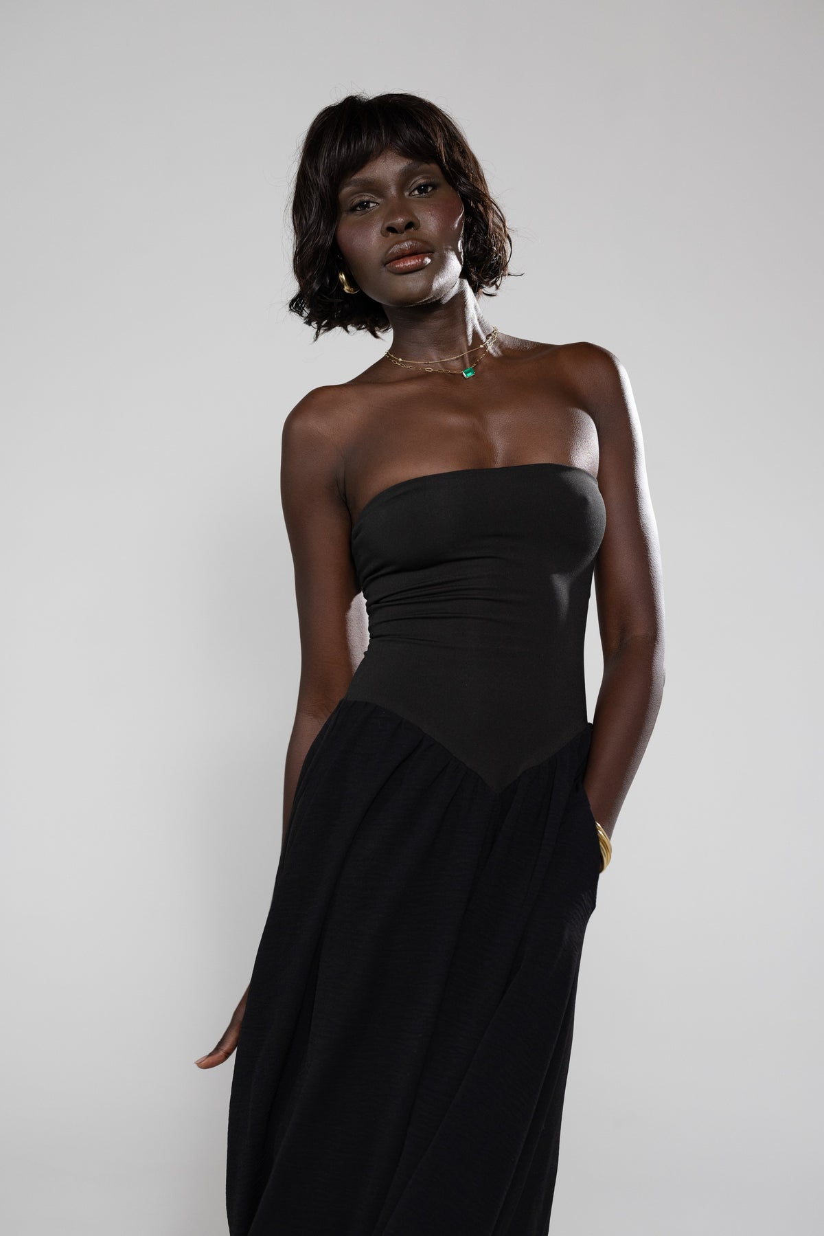 This is an image of Mackenzie Dress in Black - RESA featuring a model wearing the dress