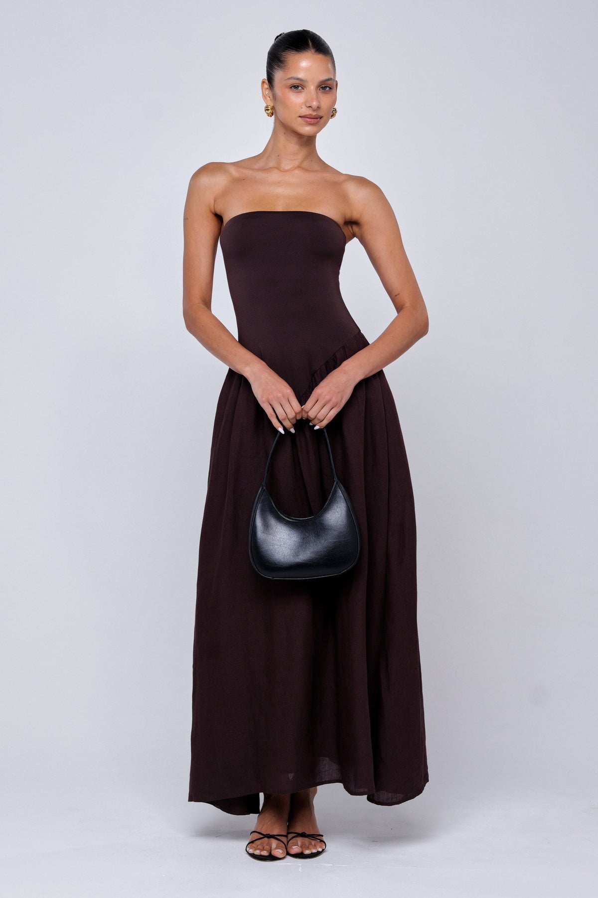 This is an image of Mackenzie Dress in Brown Linen - RESA featuring a model wearing the dress