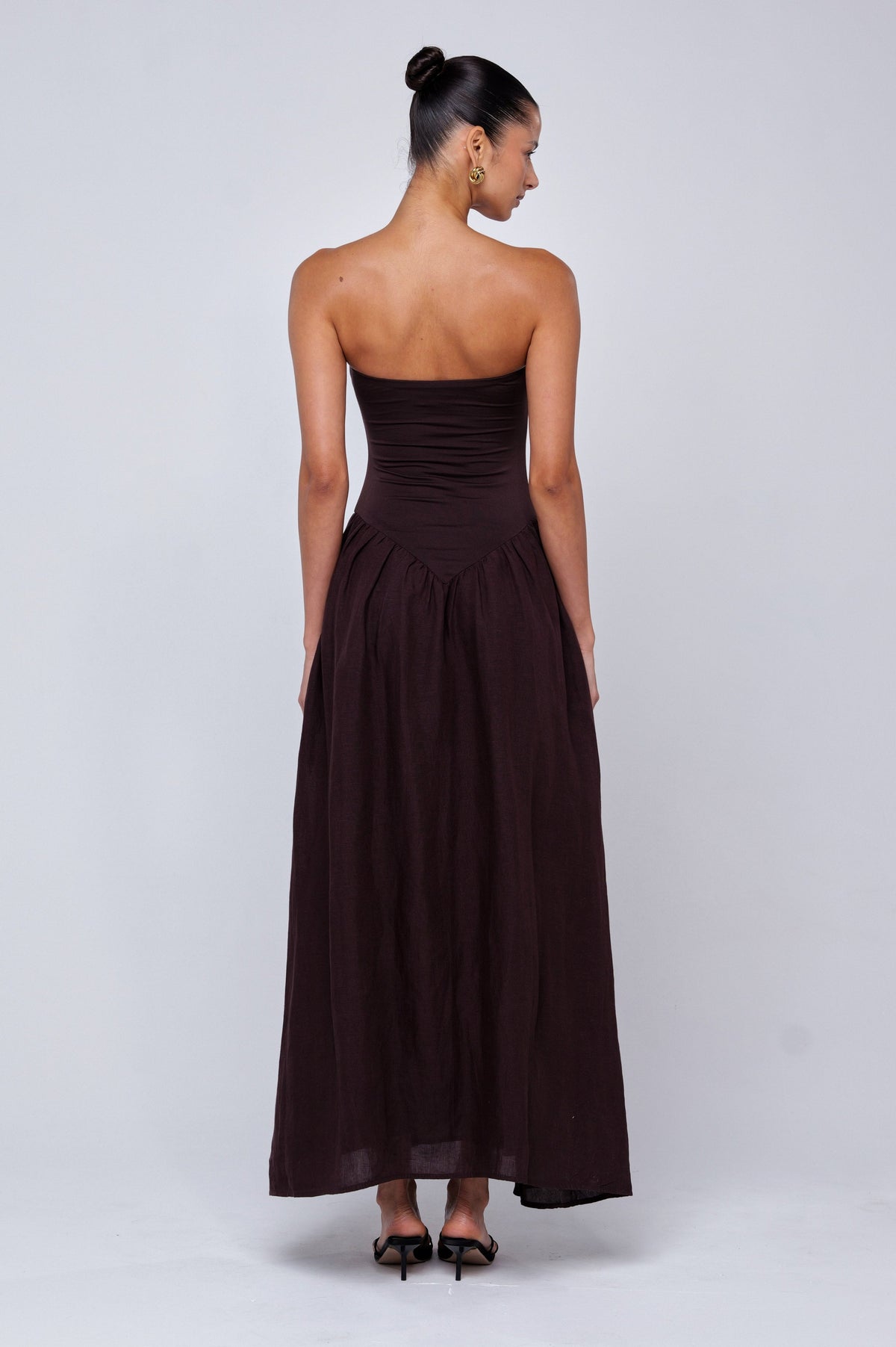 This is an image of Mackenzie Dress in Brown Linen - RESA featuring a model wearing the dress