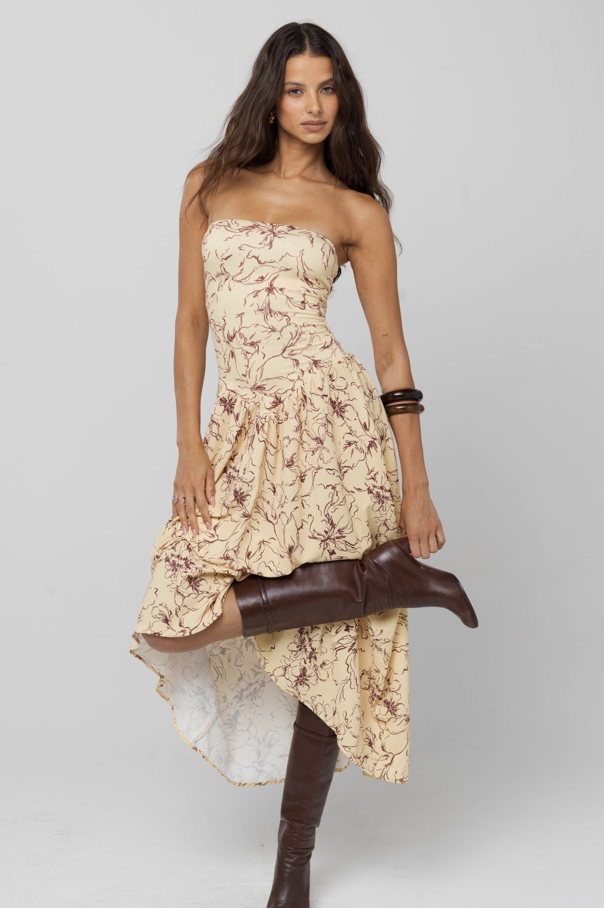 This is an image of Mackenzie Dress in Butterscotch - RESA featuring a model wearing the dress
