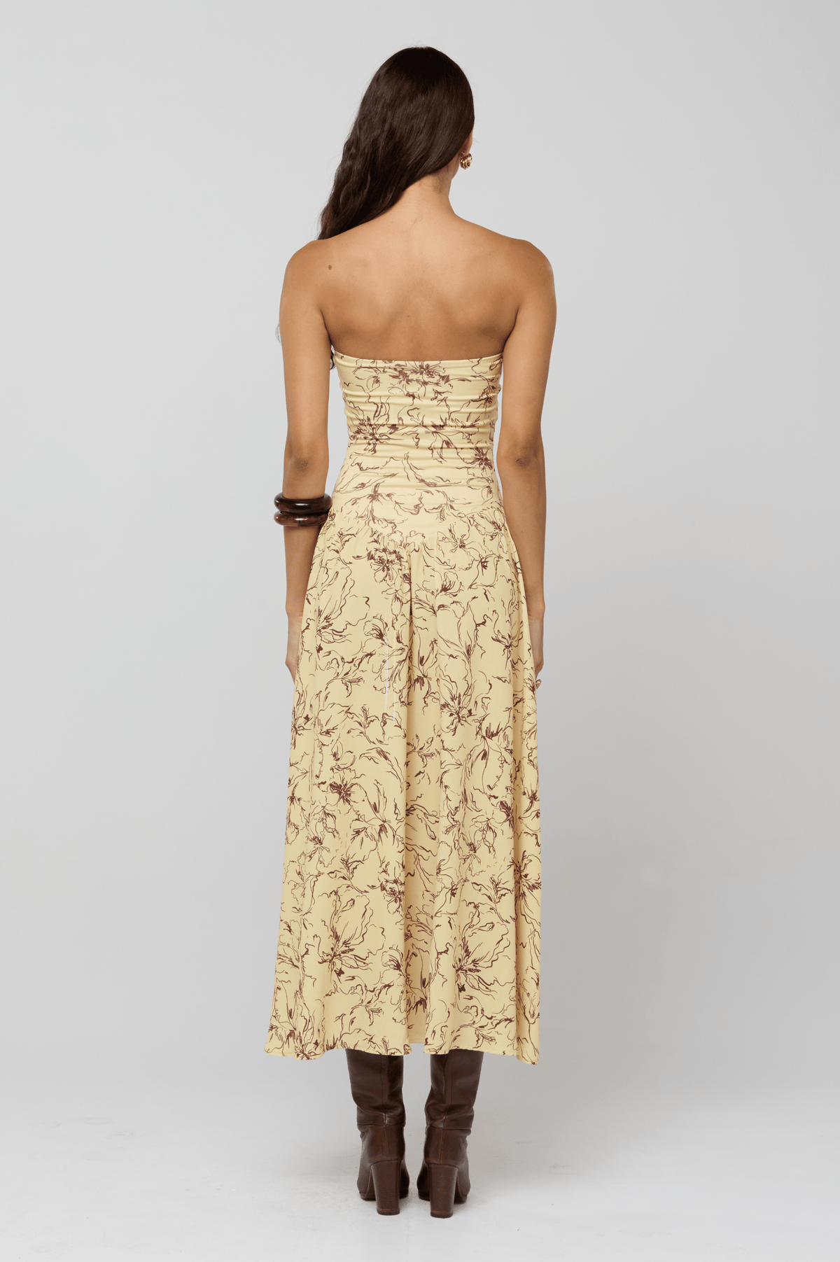 This is an image of Mackenzie Dress in Butterscotch - RESA featuring a model wearing the dress