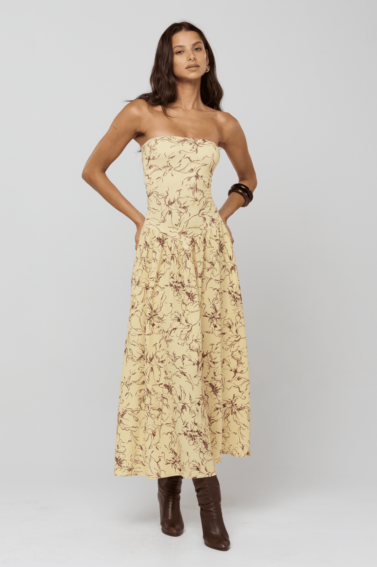 This is an image of Mackenzie Dress in Butterscotch - RESA featuring a model wearing the dress