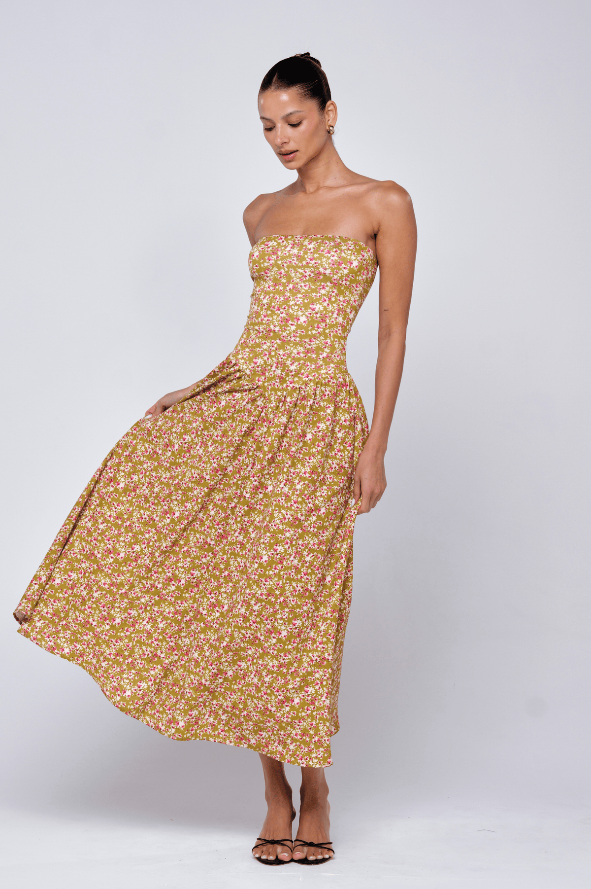 This is an image of Mackenzie Dress in Matcha - RESA featuring a model wearing the dress