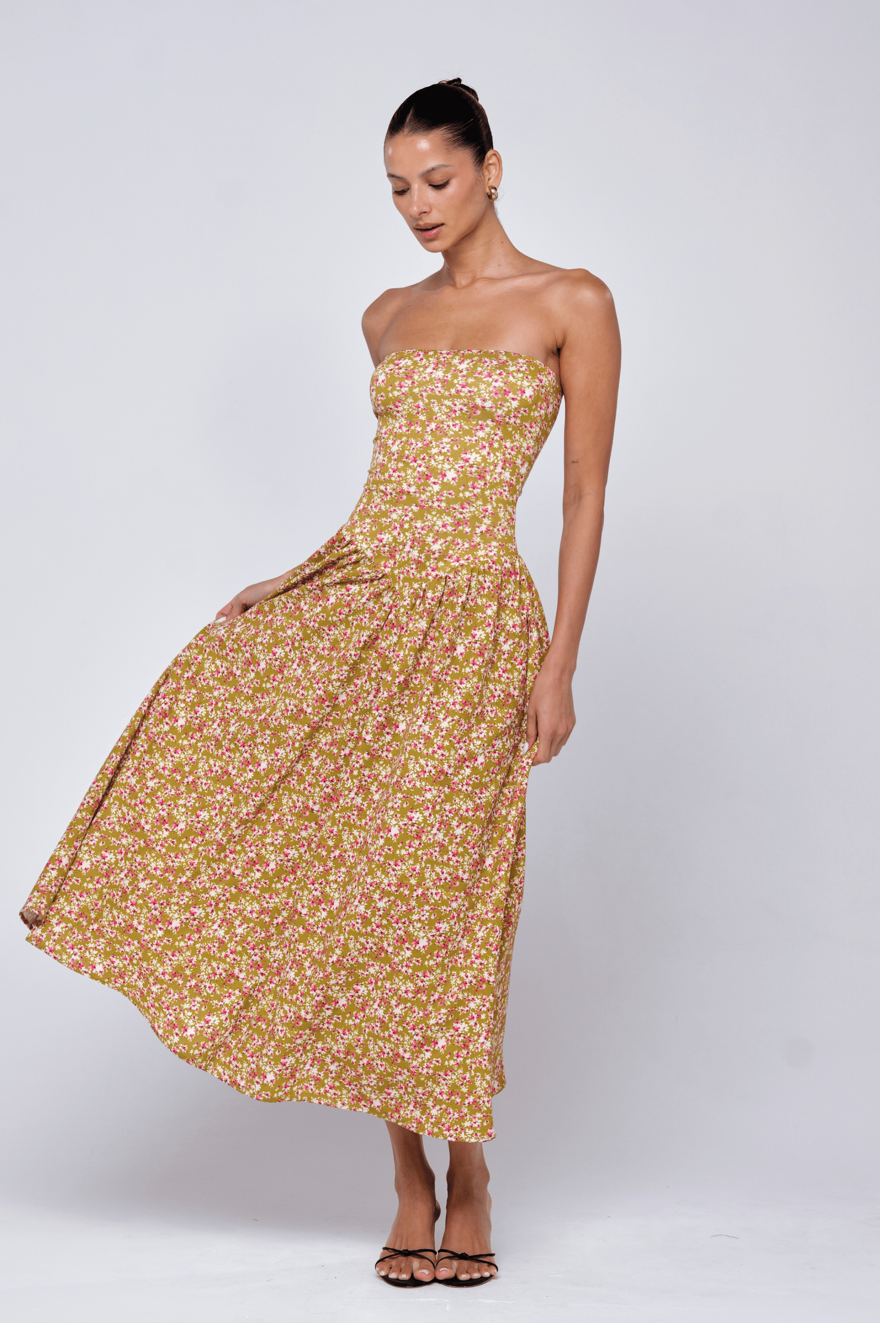 This is an image of Mackenzie Dress in Matcha - RESA featuring a model wearing the dress