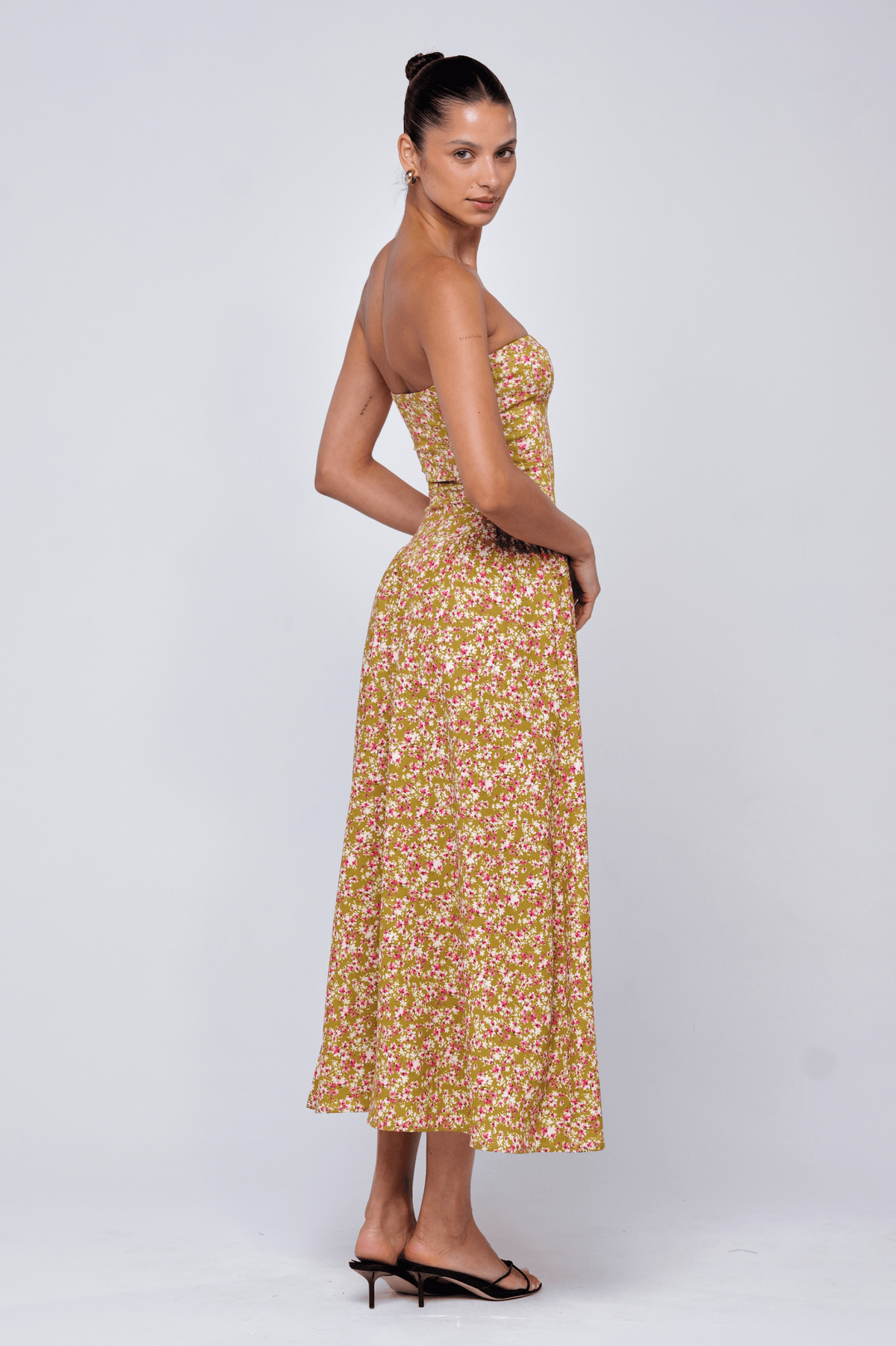 This is an image of Mackenzie Dress in Matcha - RESA featuring a model wearing the dress