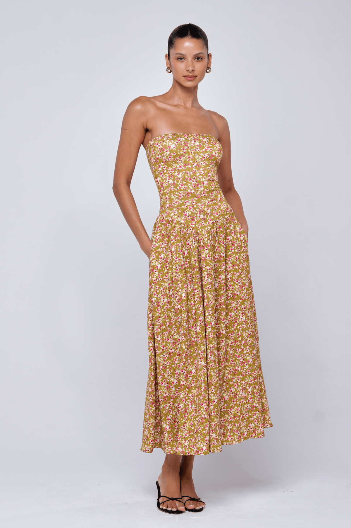 This is an image of Mackenzie Dress in Matcha - RESA featuring a model wearing the dress