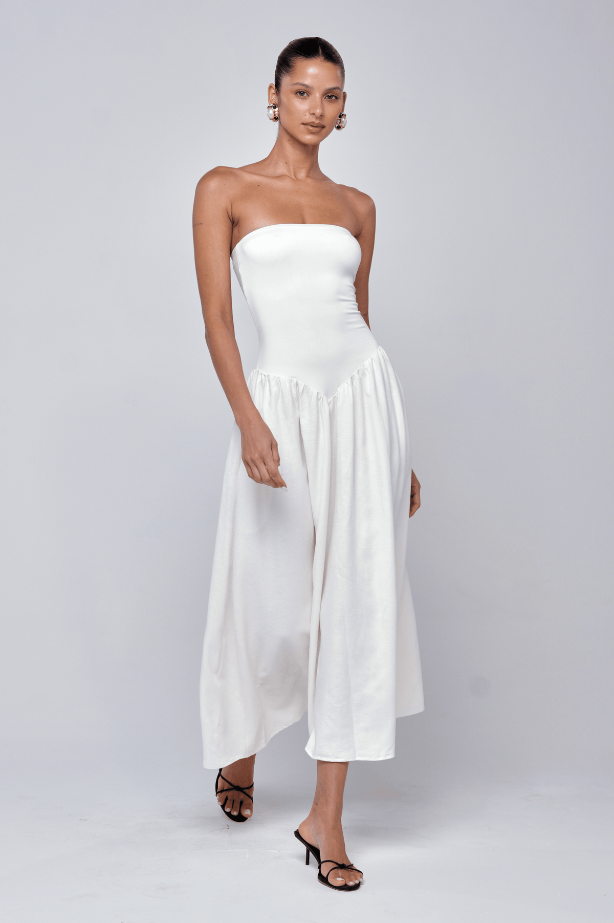 This is an image of Mackenzie Dress in White Linen - RESA featuring a model wearing the dress
