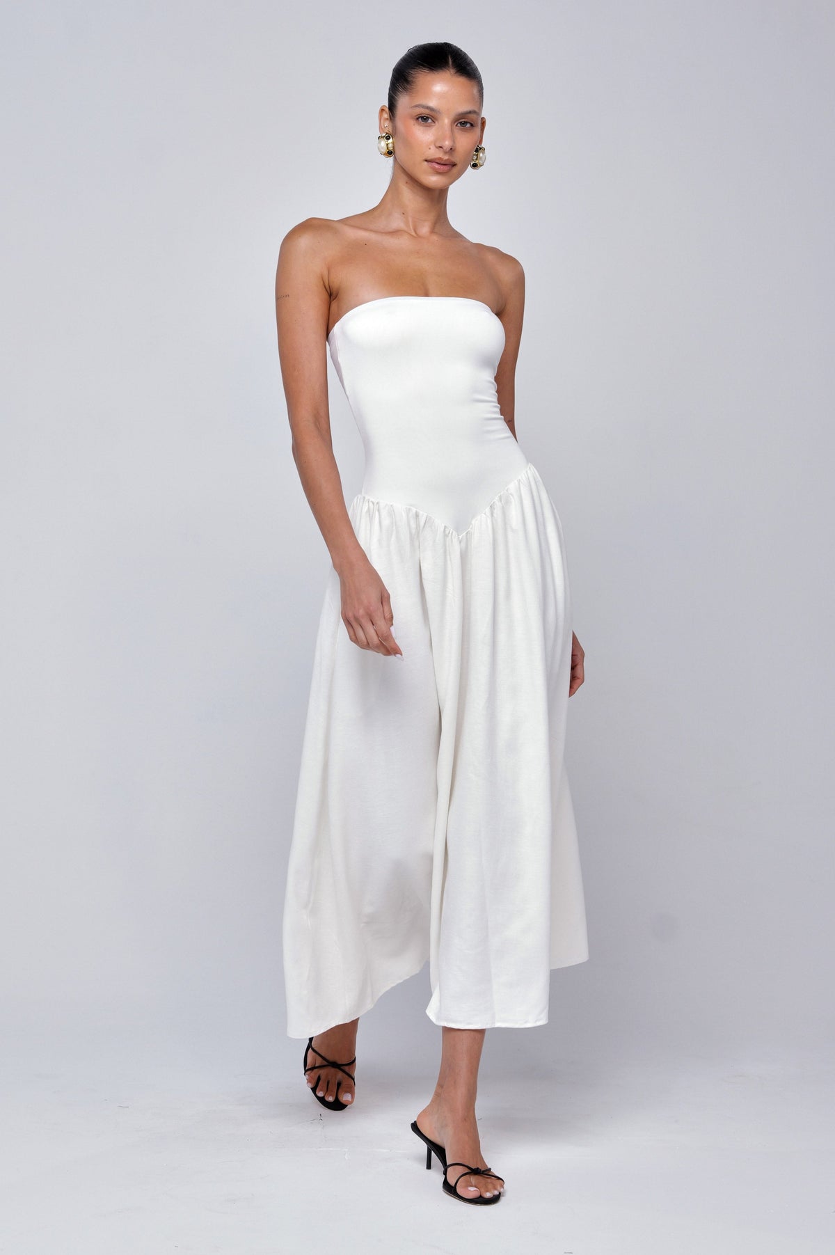 This is an image of Mackenzie Dress in White Linen - RESA featuring a model wearing the dress